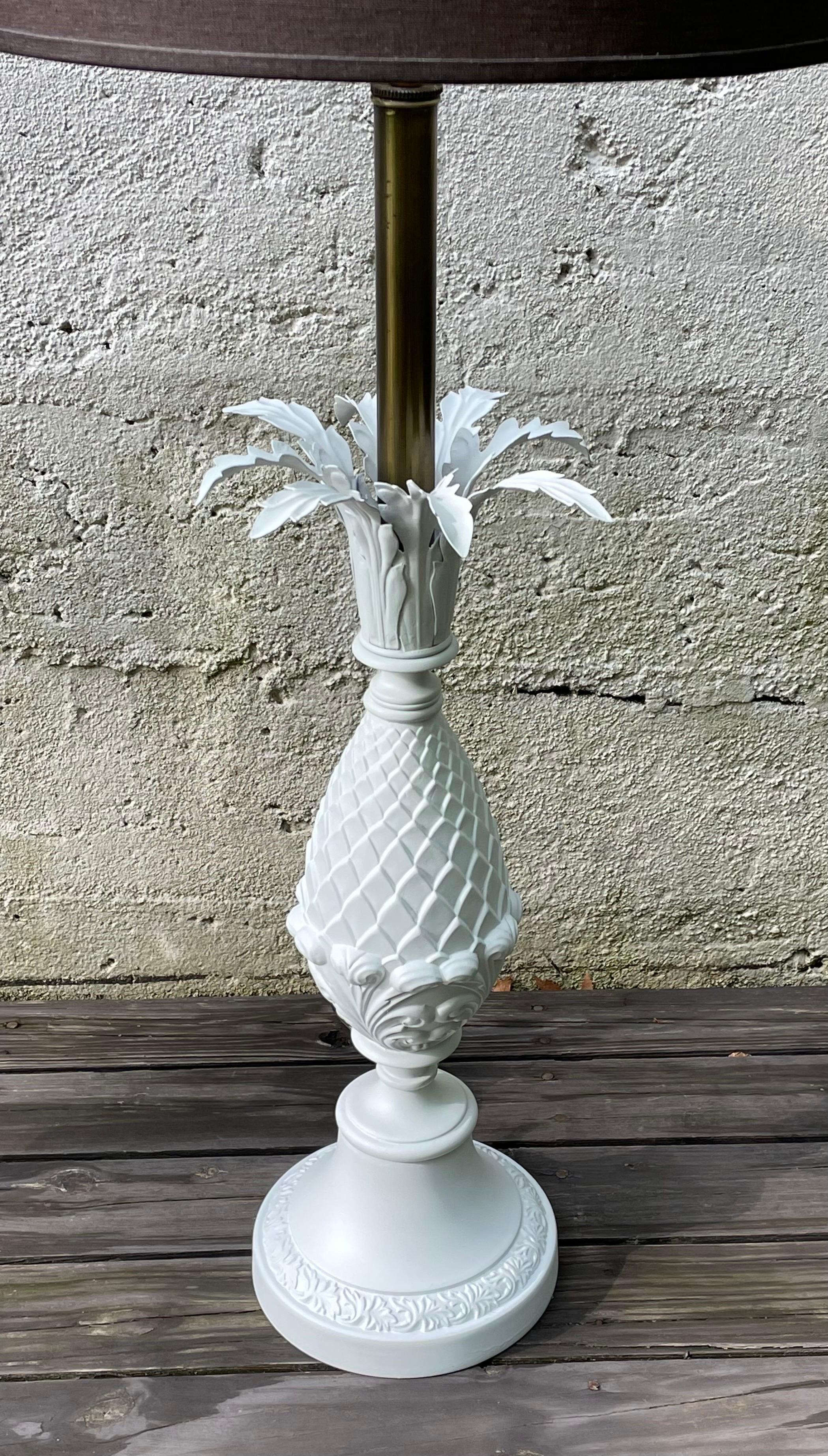 Stunning pair of Hollywood Regency table lamps, pineapple shape with leafs, painted brilliant white, large scale. Rewired, shades and harps not included.