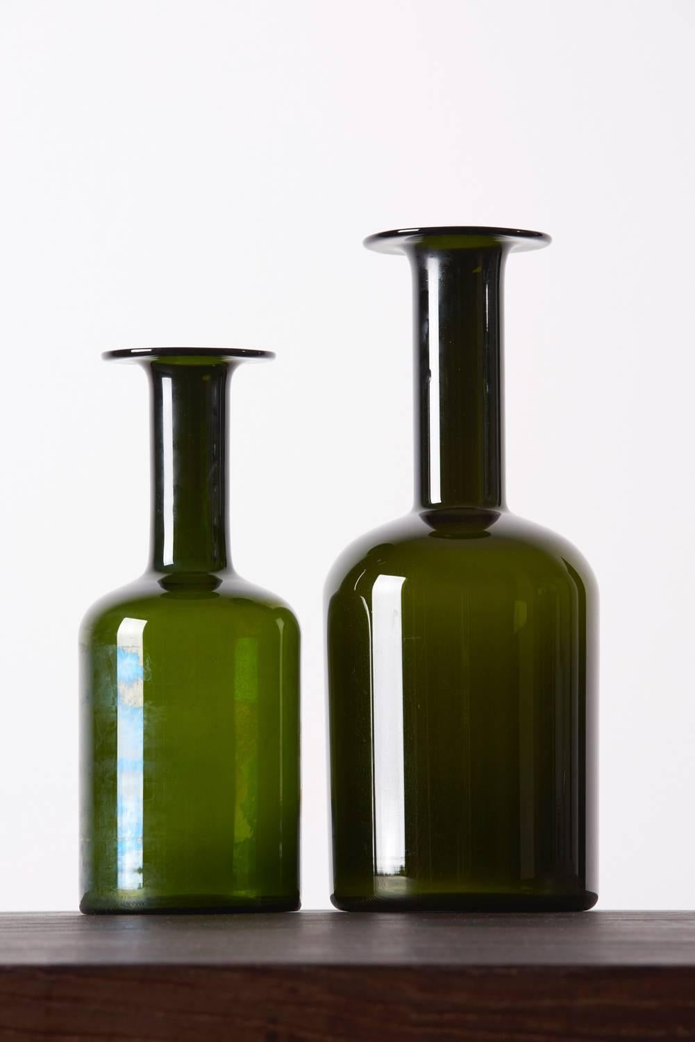 A pair of Holmegaard Gulvvases vase by Otto Brauer, in olive.
The taller one standing measures 37cm / 15