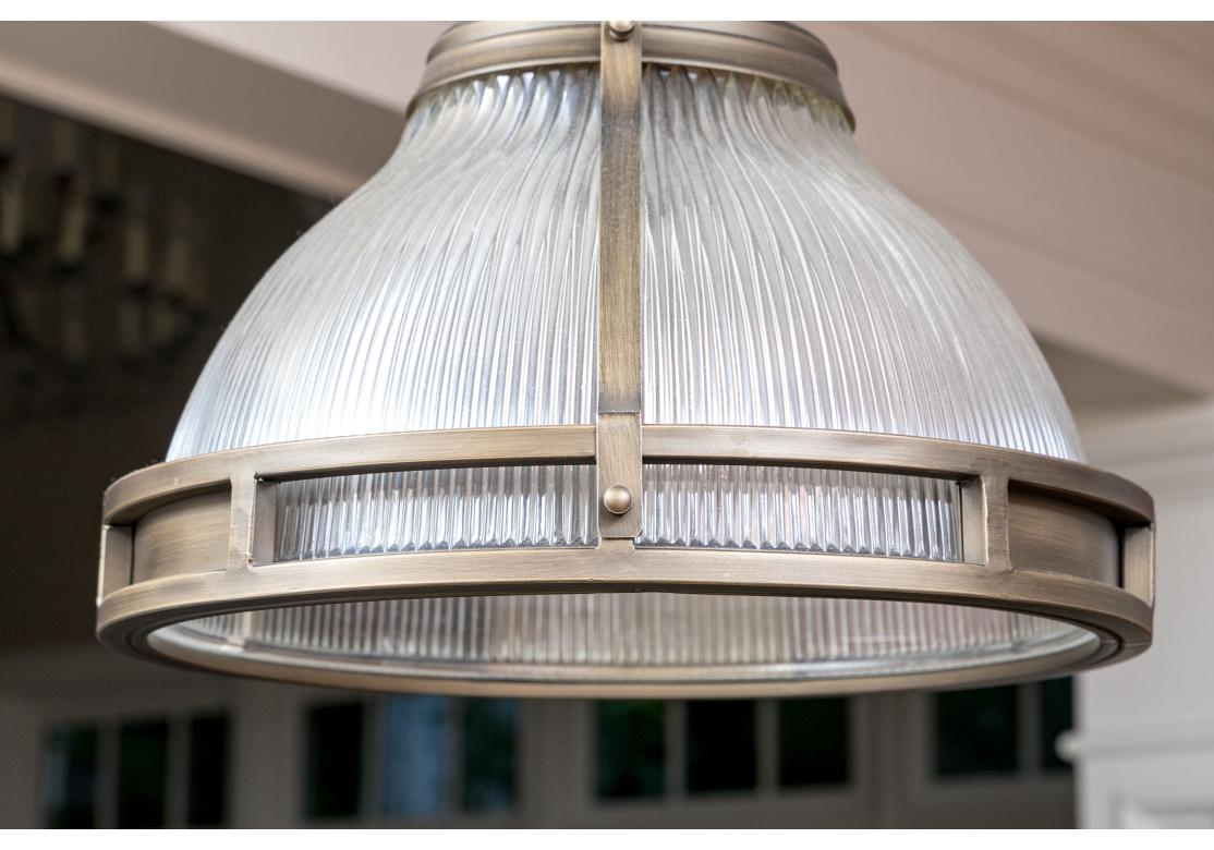 Metal Pair Of Holophane Glass Pendant Lights For Sale