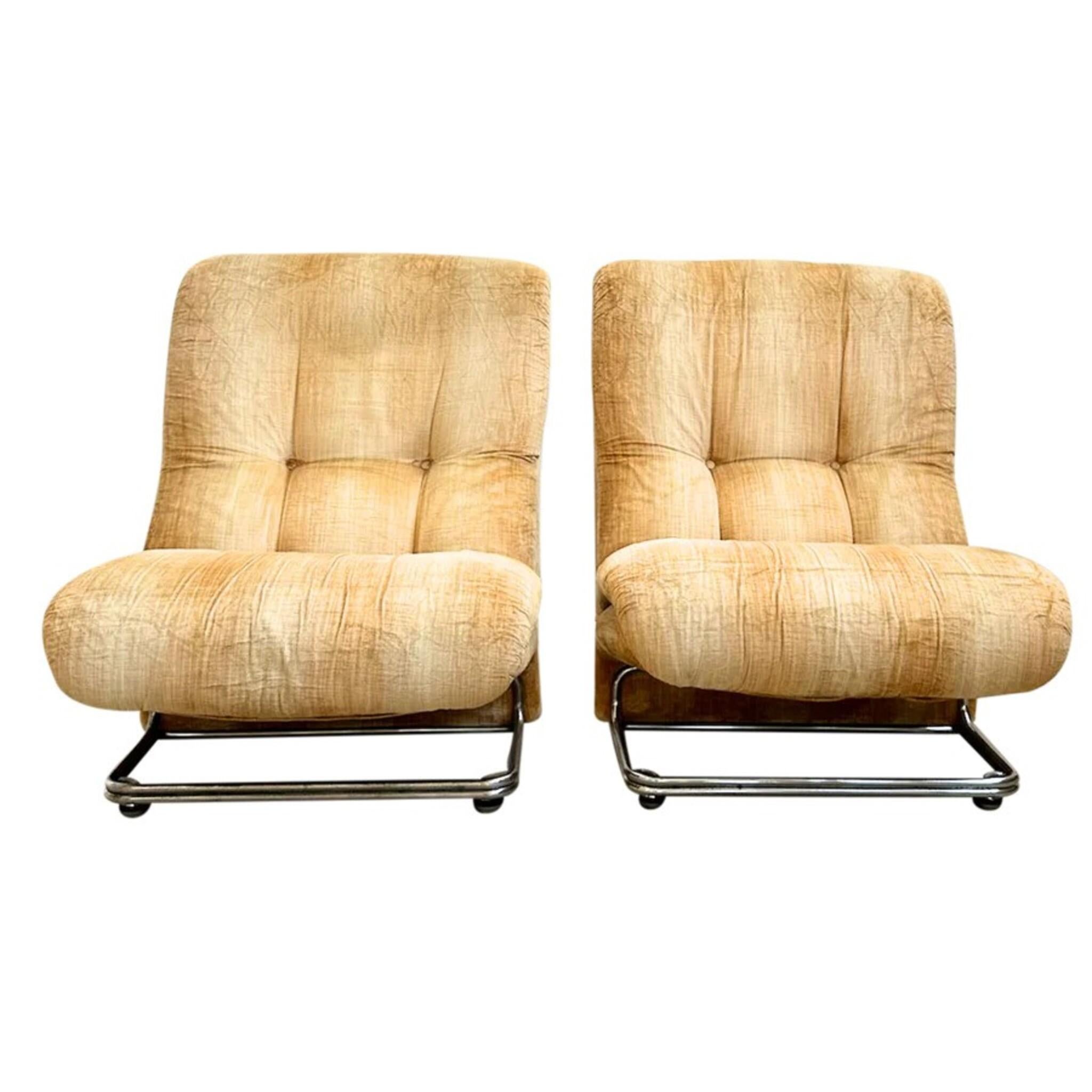 Pair of 1970s cantilever lounge chairs with tubular chrome bases and soft, sculpted lines. Upholstered in crushed honey velvet with subtle tufting, the chairs lean back with an easy, slouched posture.