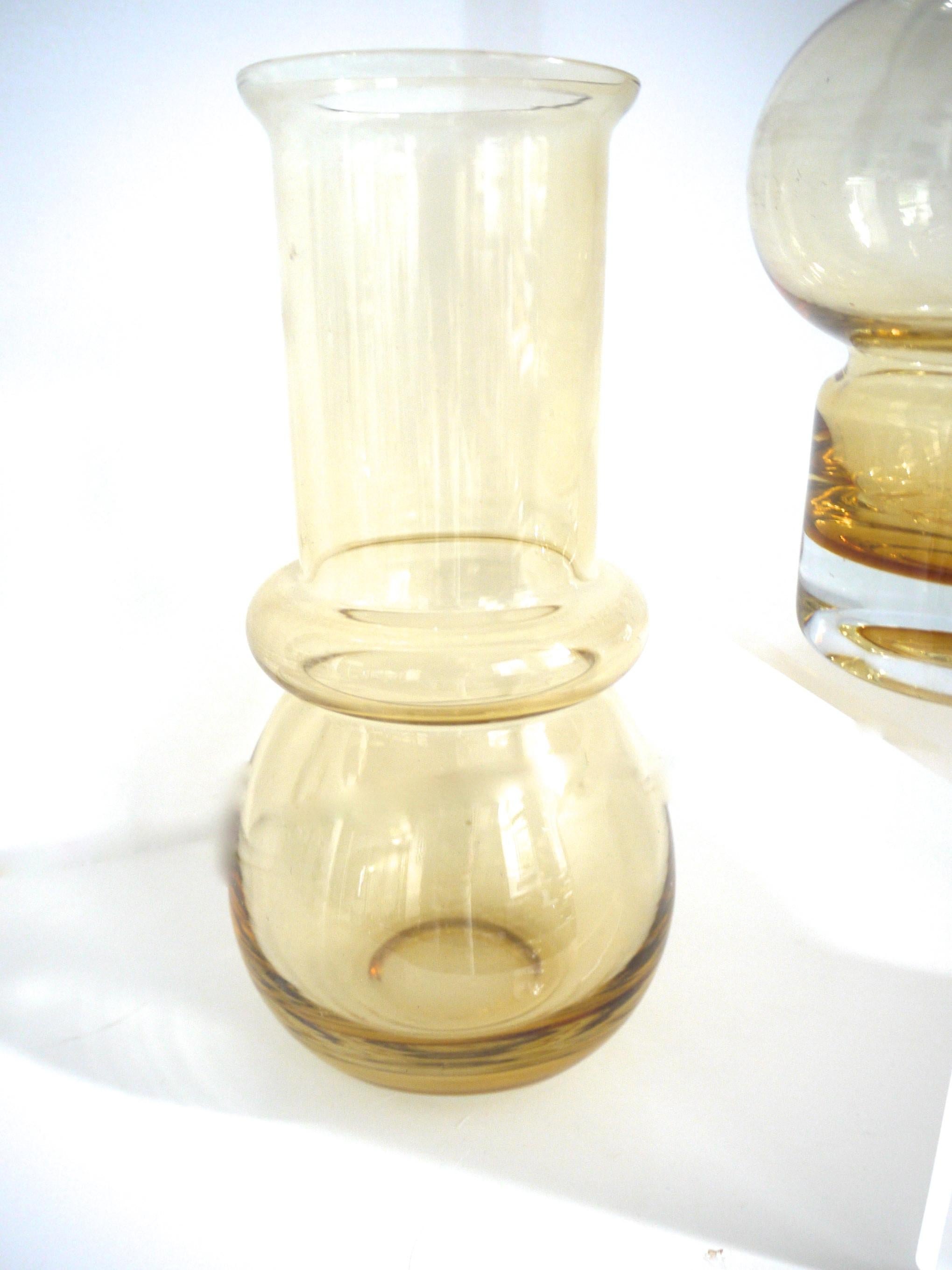 Pair of hooped vases from Riihmaen Lasi, late 1950s, Finland in 1910

Riihimäkem Lasi part of the reputed glass company in Riihimäki, Finland, in operation from 1910 when it was founded by Mikko Adolf Kolehmainen, to 1990 when the factory was