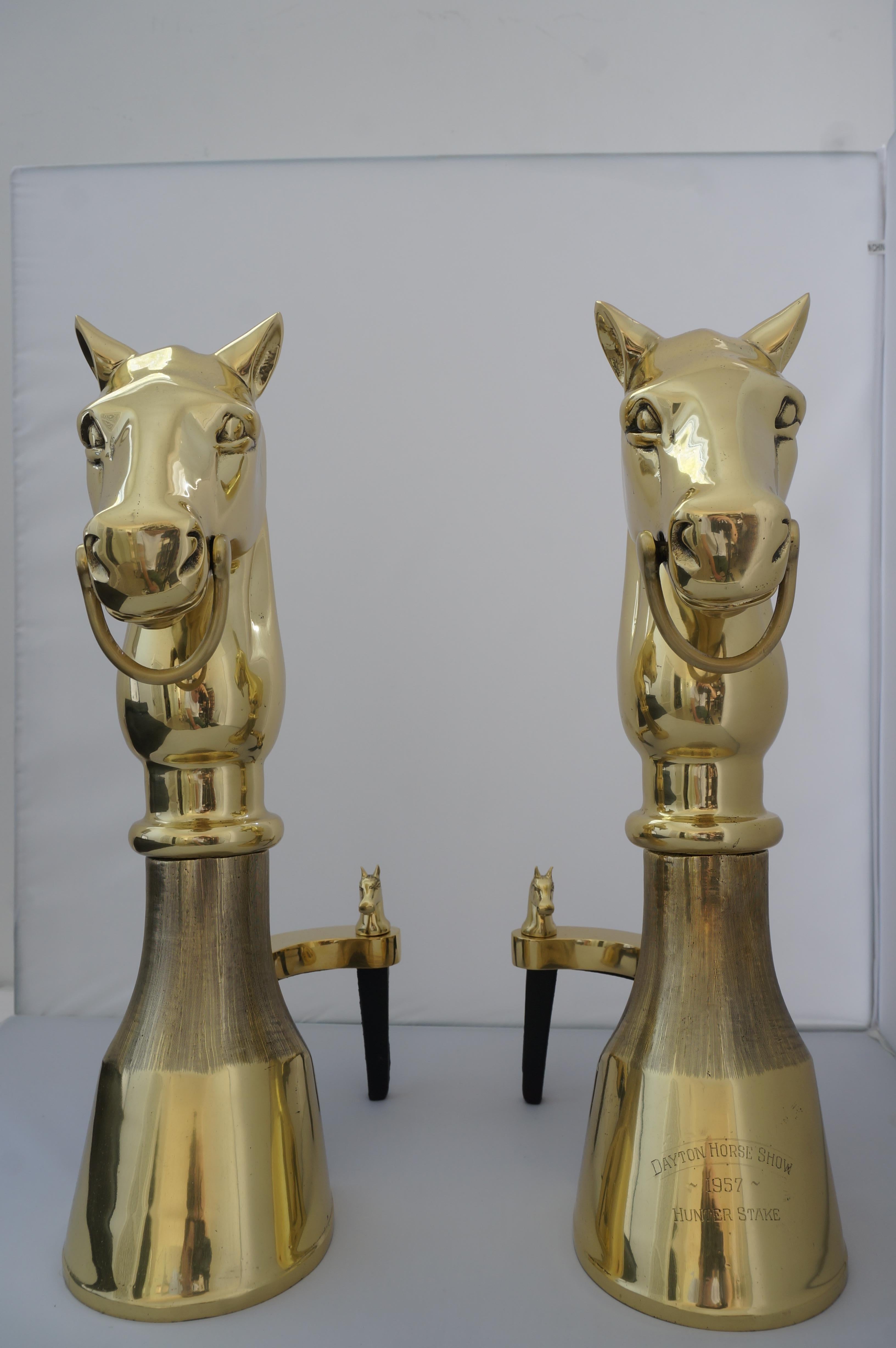 Mid-century chenets trophy hunter stakes 1957 dayton horse show in polished brass - a pair - from a Palm Beach estate.