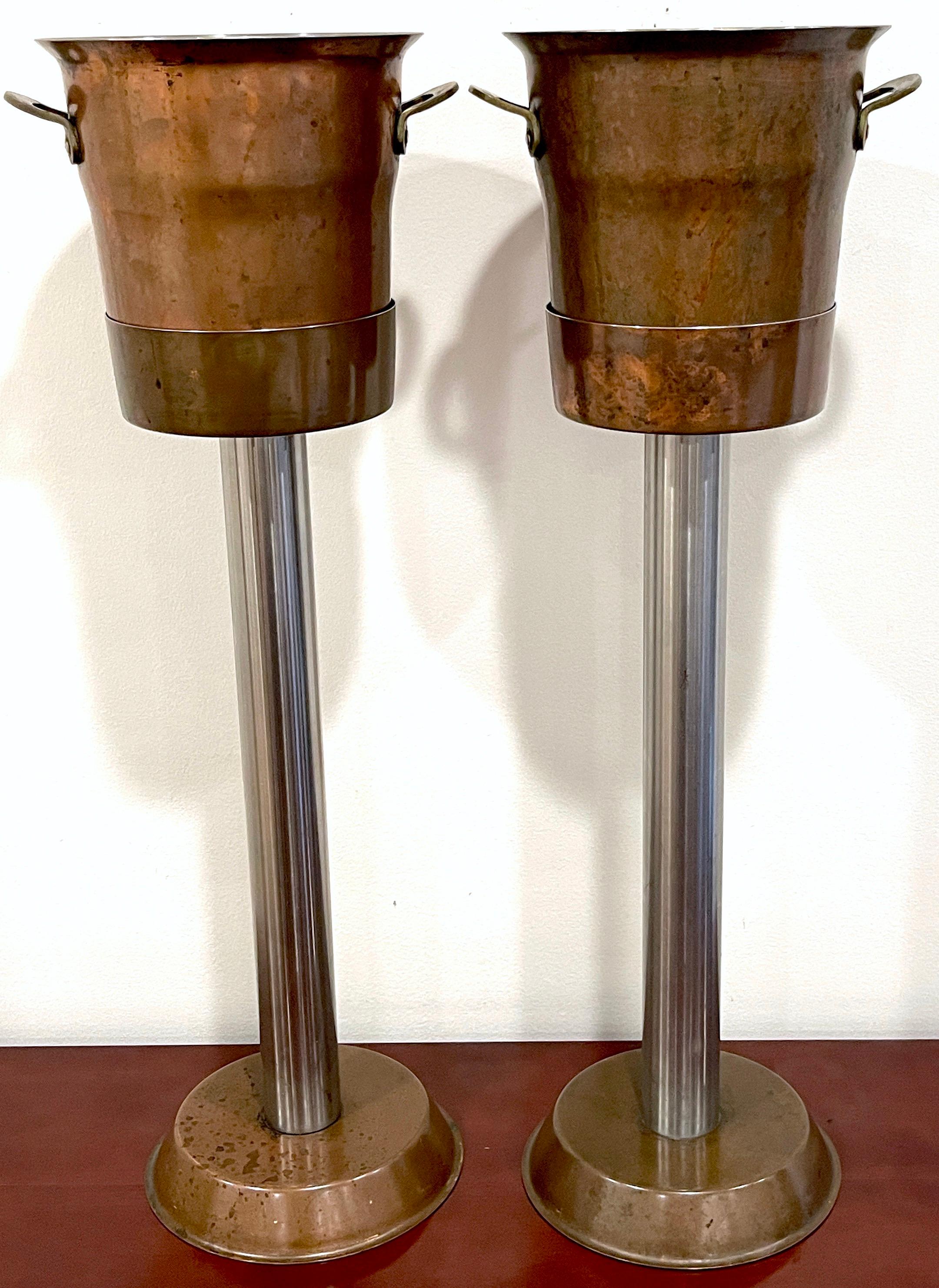 Pair of Hotel Copper & Steel Champagne Buckets & Stands, by Spring Culinox
Switzerland, Circa 1960s 
A exceptional pair of vintage Hotel Copper & Steel Champagne Buckets with Stands, made by the renowned Spring Culinox in Switzerland during the