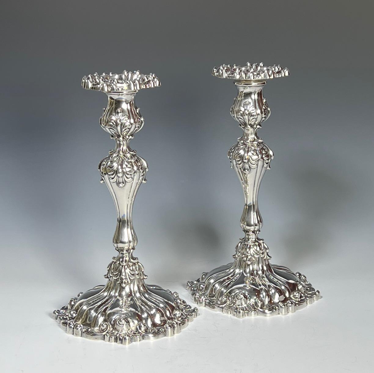 This pair of elaborate sterling silver candlesticks will set the table with many options for centerpieces. The sophisticated decoration of leaves and swirling silver embellish the base, the bobeches are removable for easy cleaning and polishing and