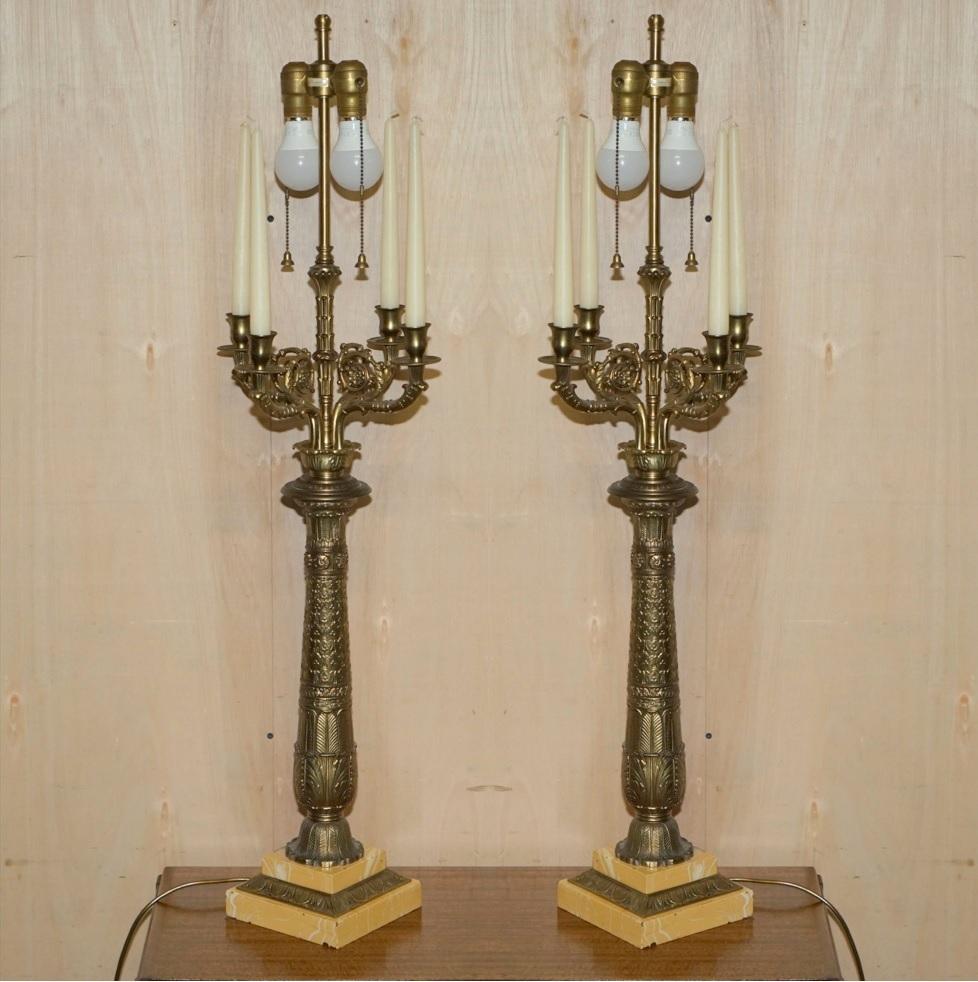 We are delighted to offer for sale this huge pair of original vintage Warren Kessler New York, Repousse brass, four branch candle, candelabra table lamps with twin bulbs.

A very good looking, decorative and collectable pair of table lamps that