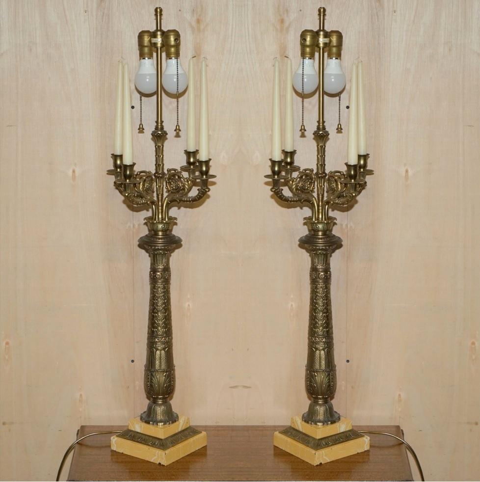 We are delighted to offer for sale this huge pair of original vintage Warren Kessler New York, Repousse brass, four branch candle, candelabra table lamps with twin bulbs.

A very good looking, decorative and collectable pair of table lamps that
