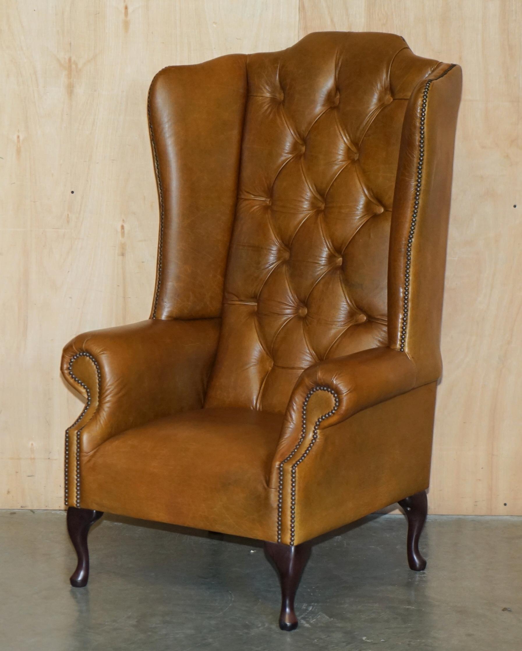 Royal House Antiques

Royal House Antiques is delighted to offer for sale this stunning pair of vintage, extra tall Chesterfield Tufted Wingback armchairs in Heritage brown leather 

Please note the delivery fee listed is just a guide, it covers