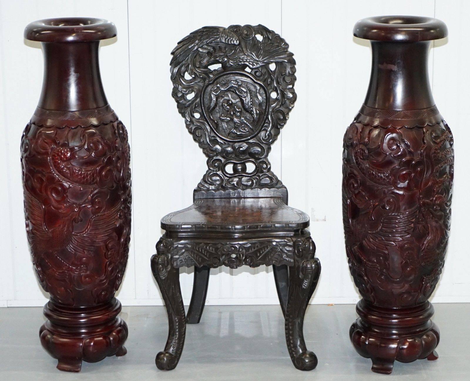 We are delighted to offer for sale this lovely hand-carved pair of Chinese Cinnabar vase’s depicting dragons birds and flowers.

A very good looking and well made pair, hand-carved from what looks like solid teak and then layered and layered with
