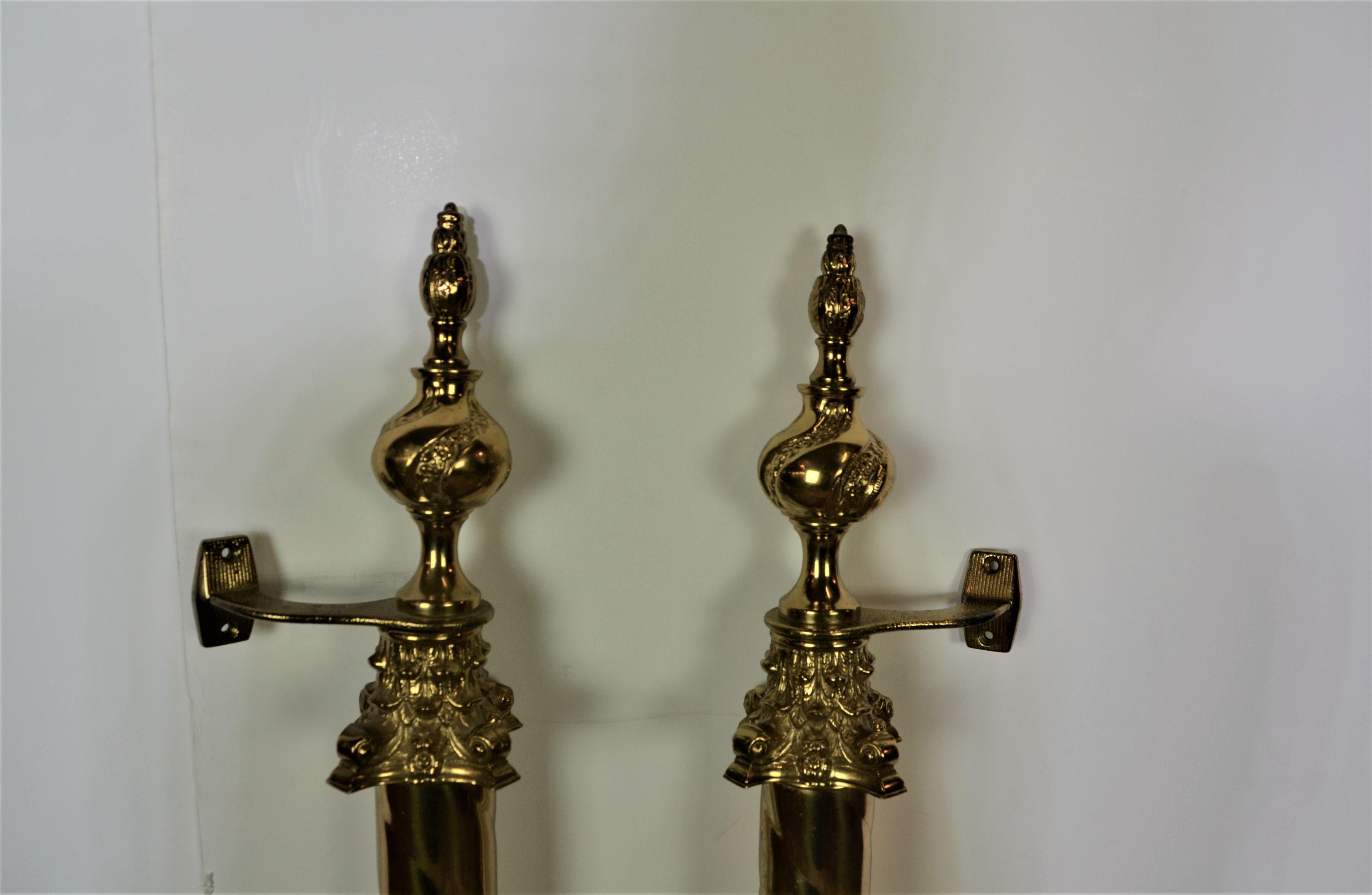 A huge pair of impressive brass door handles. Barley twist center column with Corinthian style caps and finished top and bottom with decorated finials.