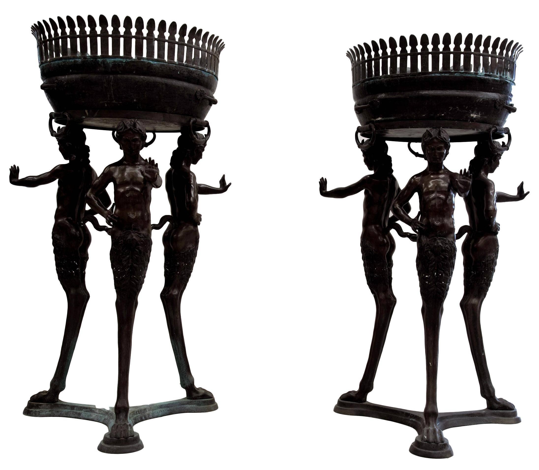 Pair of huge Italian bronze tripod vases in Roman style.