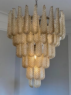 Paar riesige Murano-Kronleuchter in Bernsteinfarbe. Tronchi im Venini-Stil.