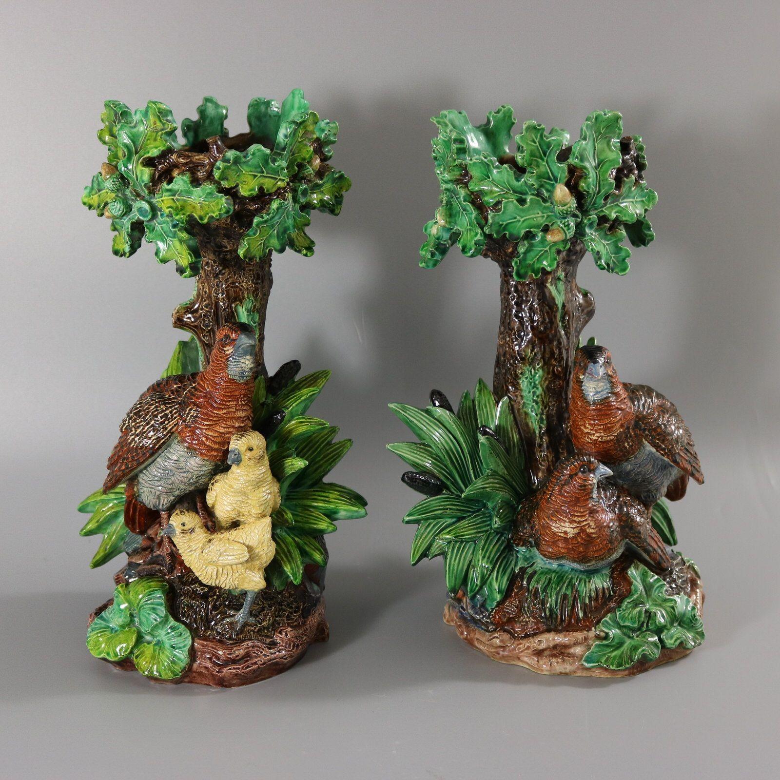 Pair of Lonitz Majolica cache pot stands which feature partridges in front of an oak tree, with reeds and bulrushes (cattails) either side. One partridge is looking after her young chicks. Colouration: green, brown, yellow, are predominant. The