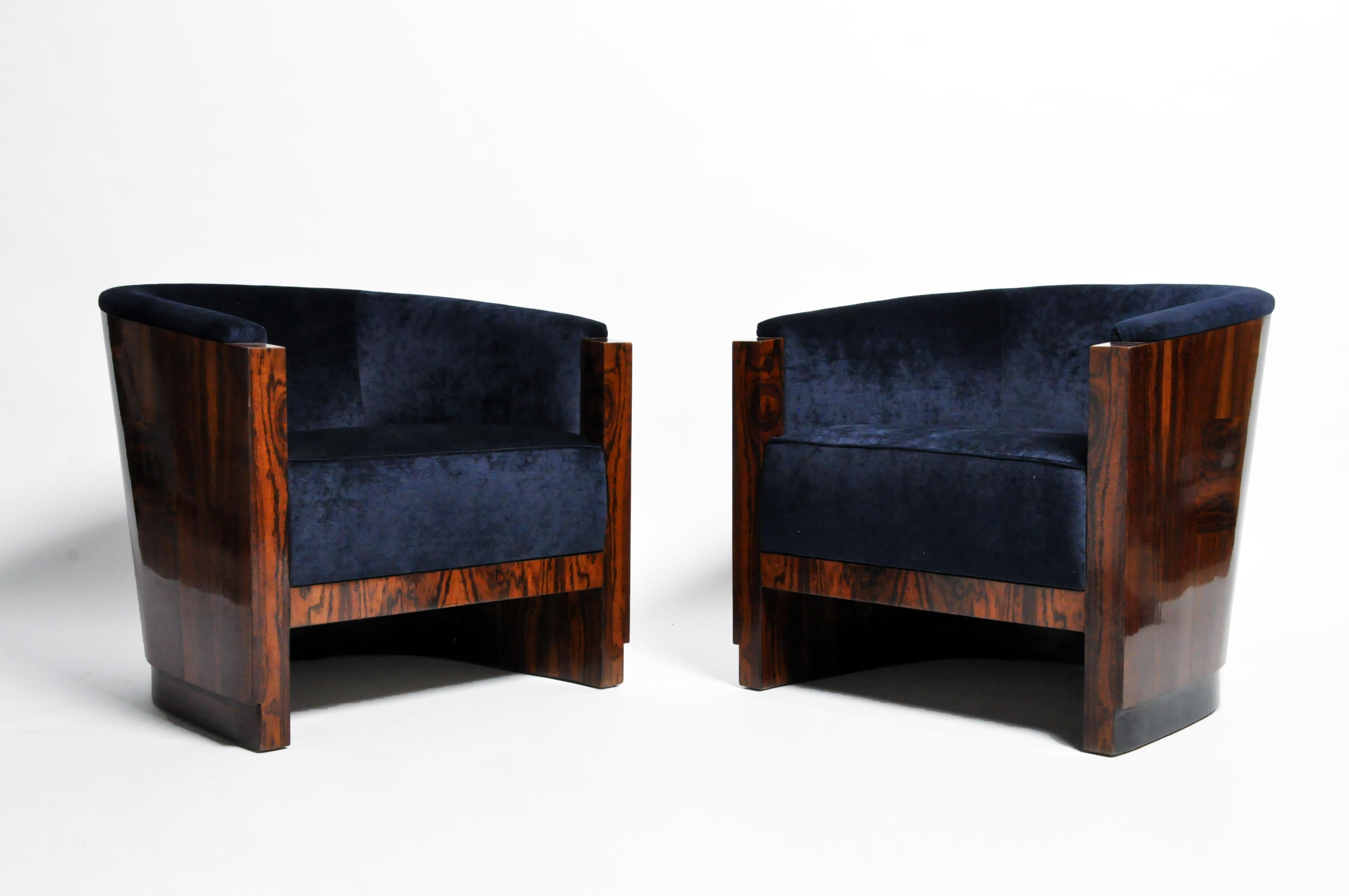 Pair of contemporary curved-back armchairs from Budapest, Hungary made from ziricote wood with new blue upholstery, circa 21st century. Price is for the pair.