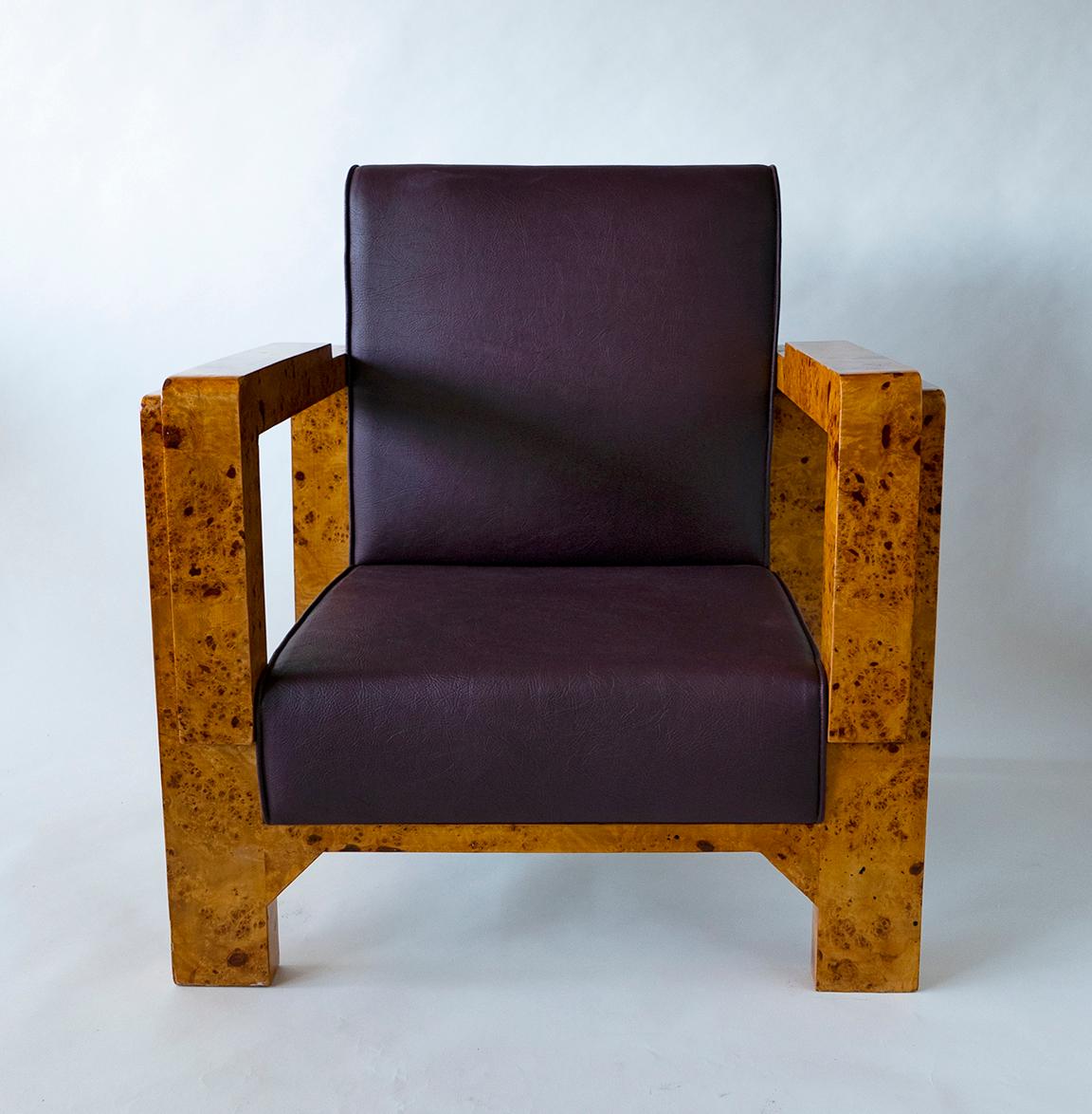 Burled and figured walnut and rootwood frames and new burgandy leather upholstery- by Hungarian master architect and furniture designer Lajos Kozma.