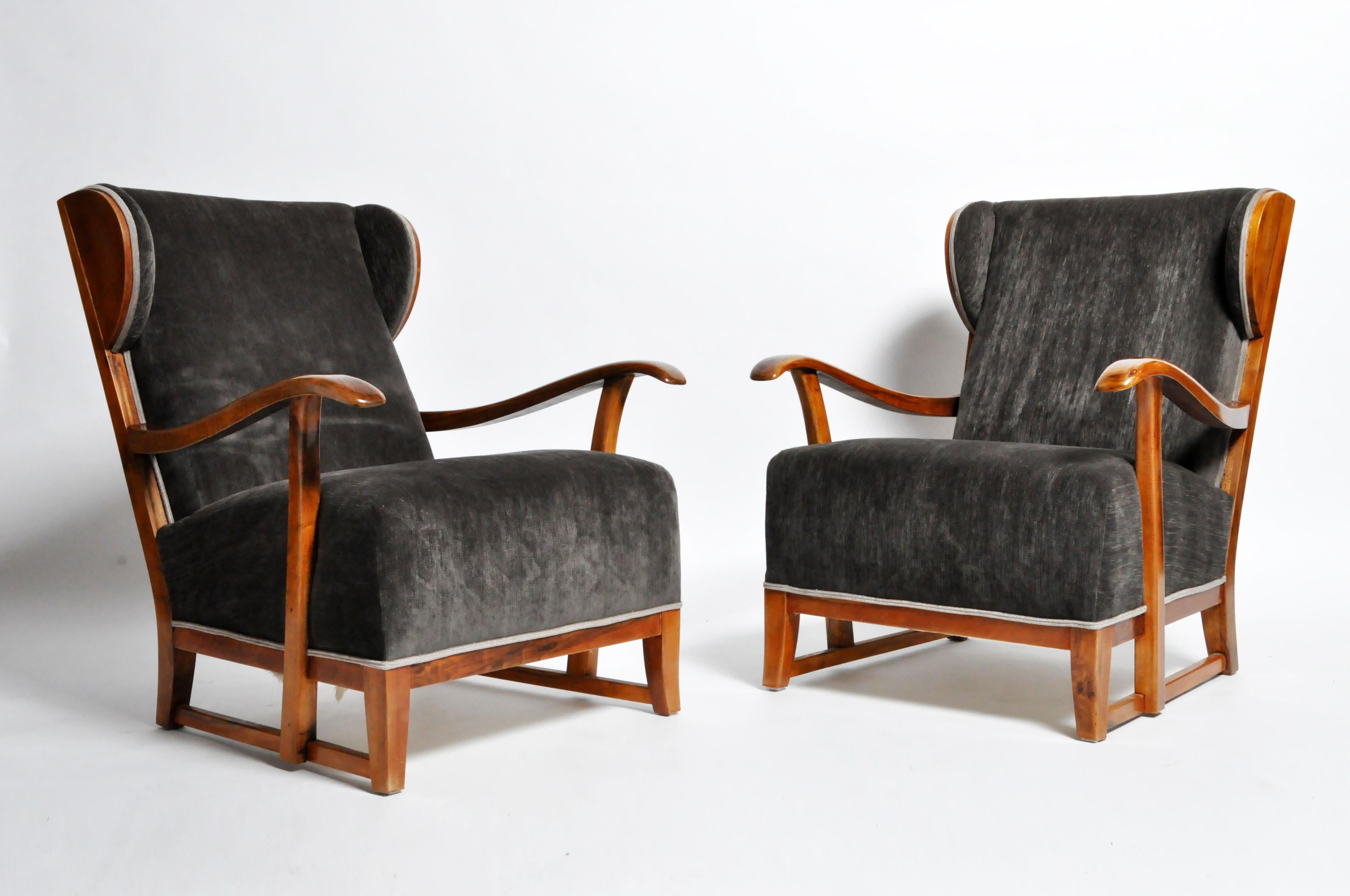 This handsome pair of armchairs are from Hungary and made from solid walnut and new upholstery, circa 1960. Strong and sturdy; ready for daily use.