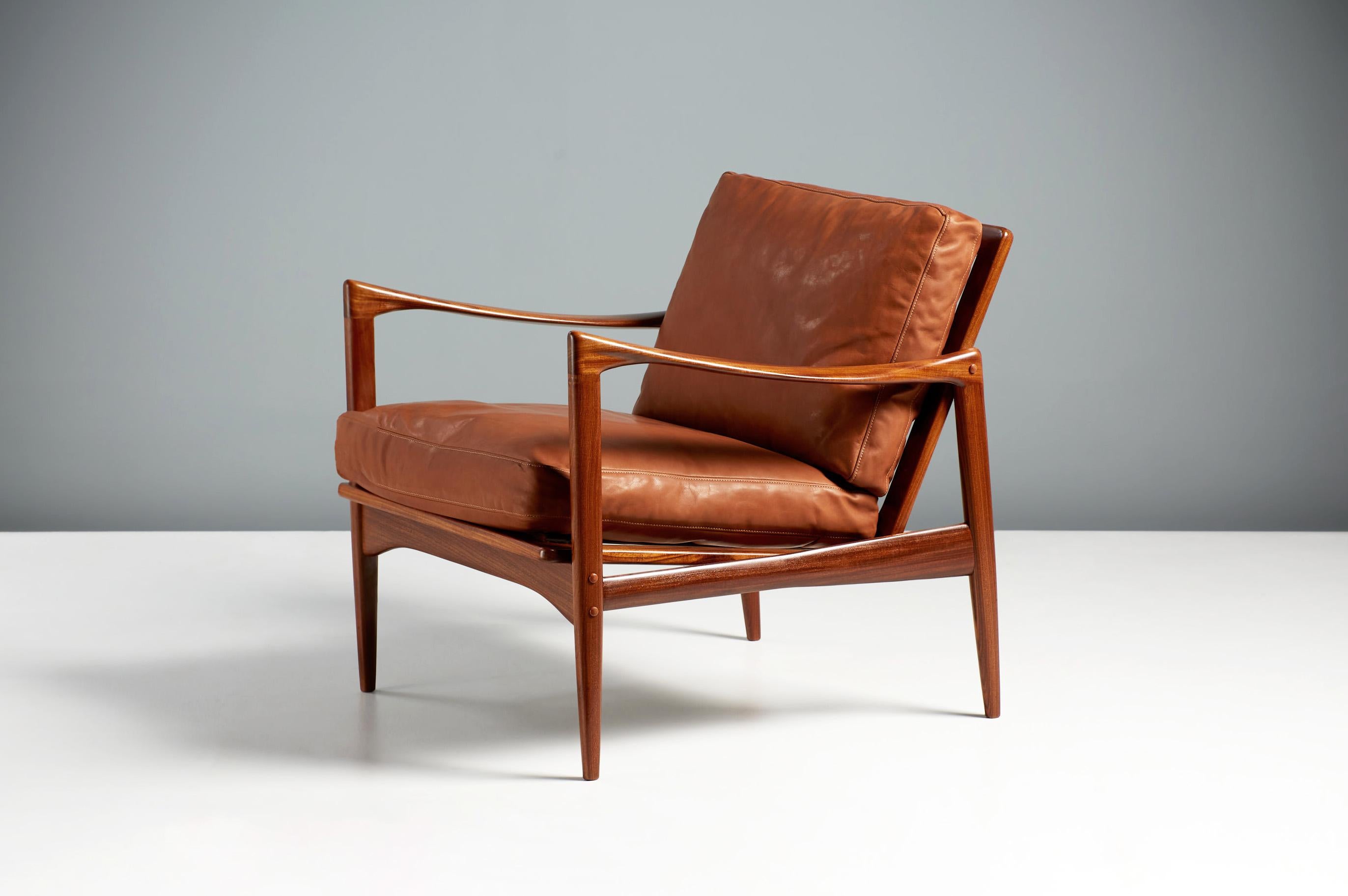 Pair of Ib Kofod-Larsen Candidate Chairs, circa 1960.

A pair of Afromosia African teak 'Kandidaten', lounge chairs produced by Olof Perssons Fatoljindustri (O.P.E.) in Jonkoping, Sweden circa 1960. The new feather filled cushions are covered in