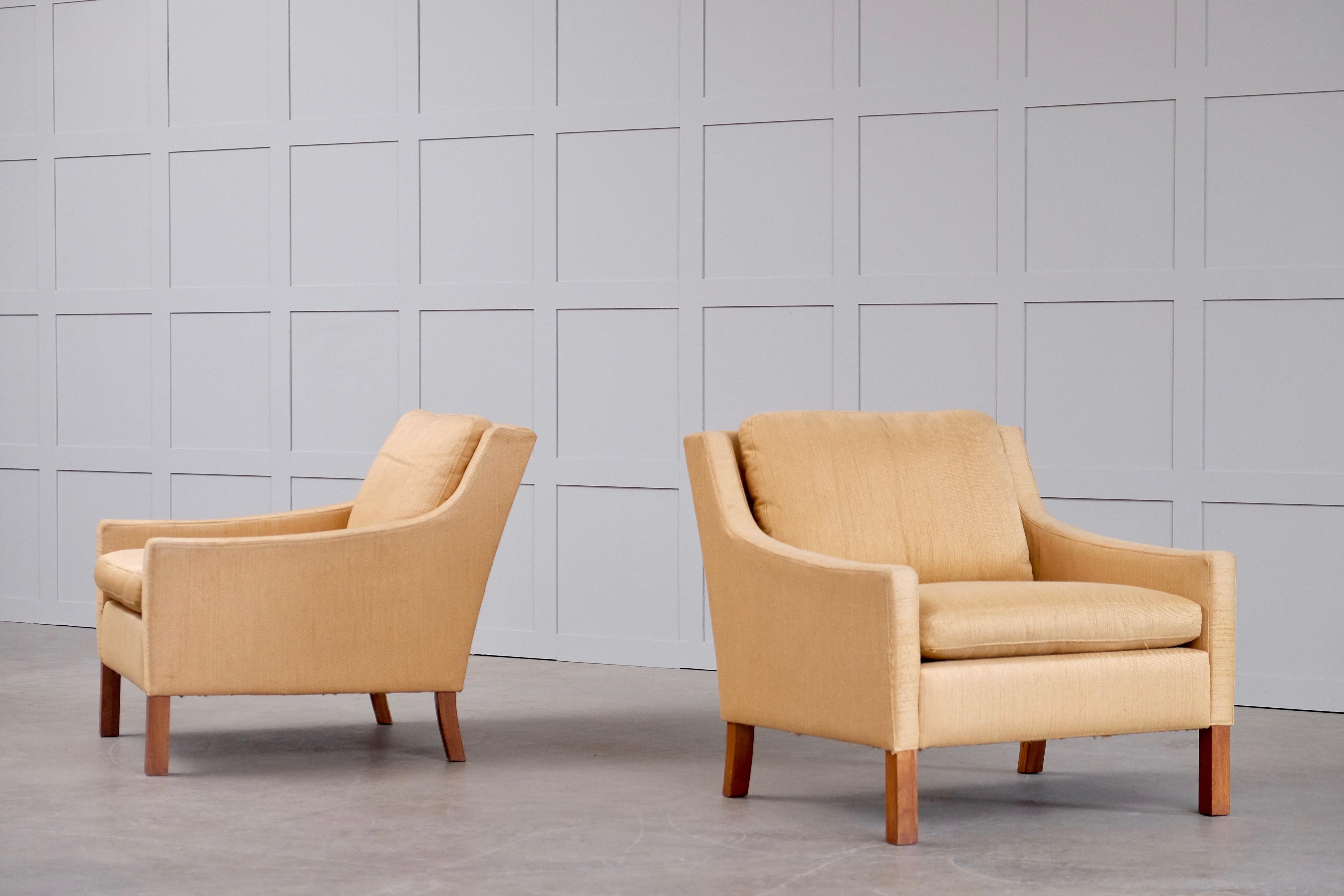 Great pair of Ib Kofod-Larsen easy chairs in original upholstery. Produced by OPE, Sweden, 1960s.
           