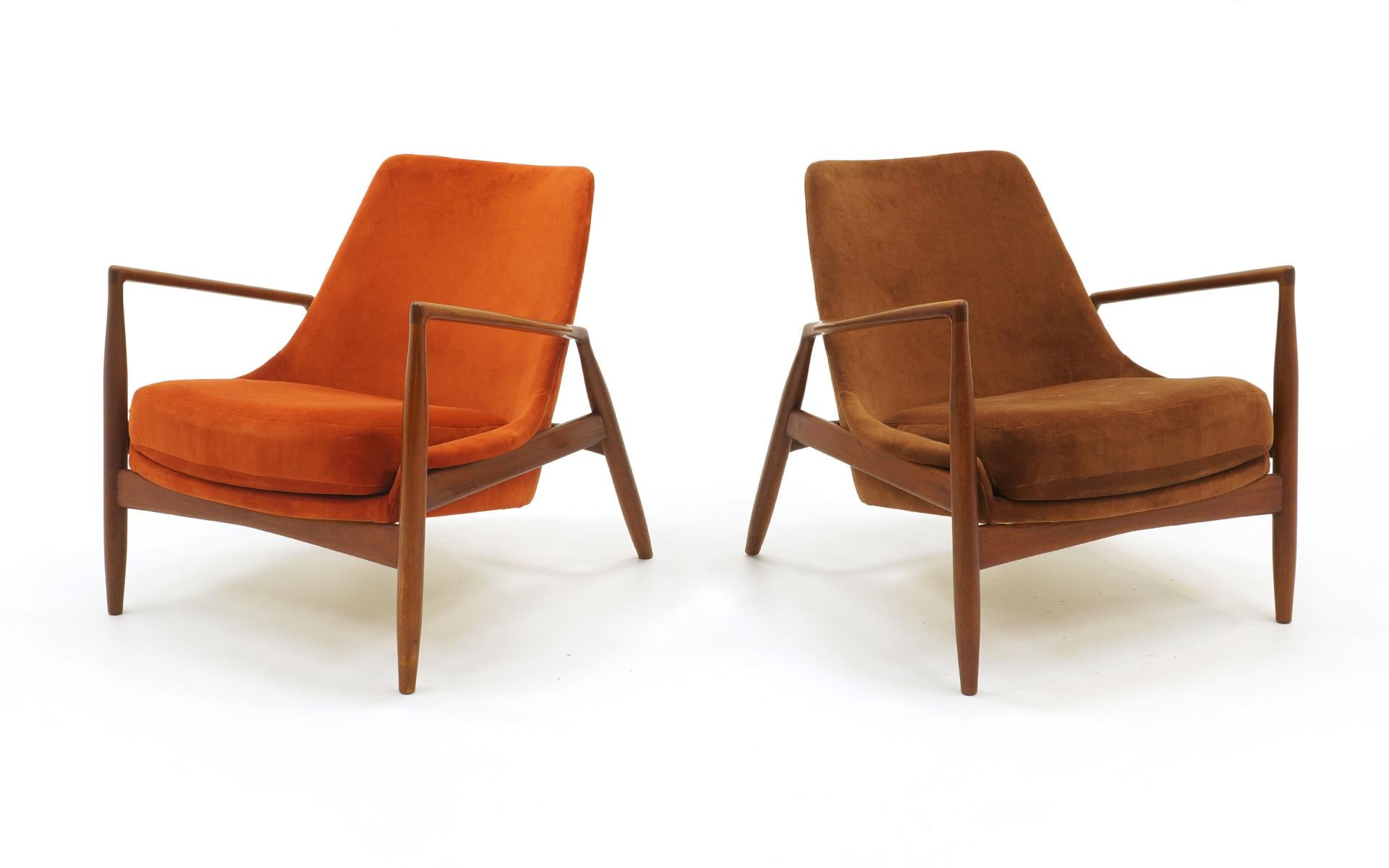 Rare pair of seal chairs by Kofod Larsen. One in a burnt orange velvet and the other in brown velvet. Same fabric, two colors. Teak frames and upholstery in very good to excellent condition.