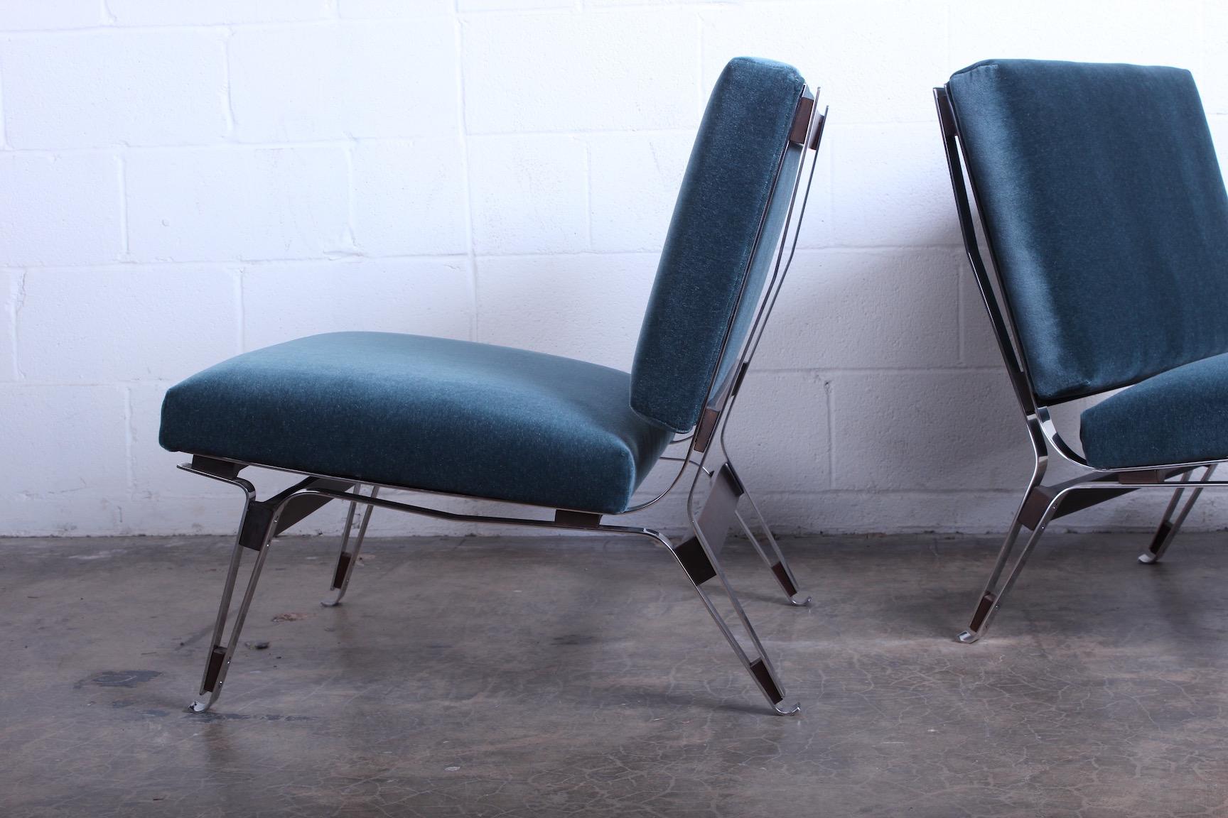 A pair of model 856 lounge chairs designed by Ico Parisi for Cassina. Upholstered in mohair.