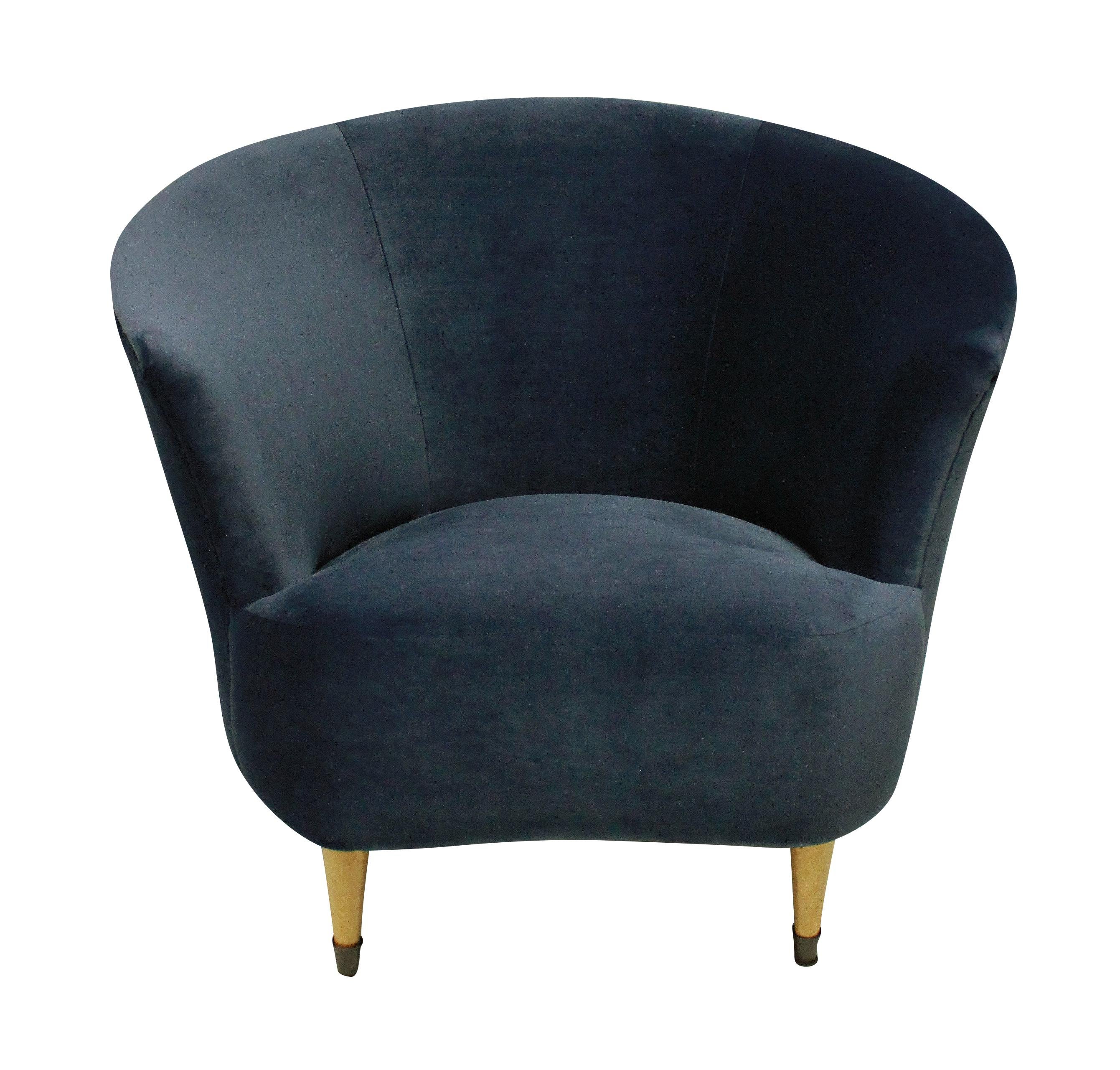 A pair of Ico Parisi cocktail chairs. Two curved armchairs with blond wood turned legs and brass sabot. Newly upholstered in blue velvet.