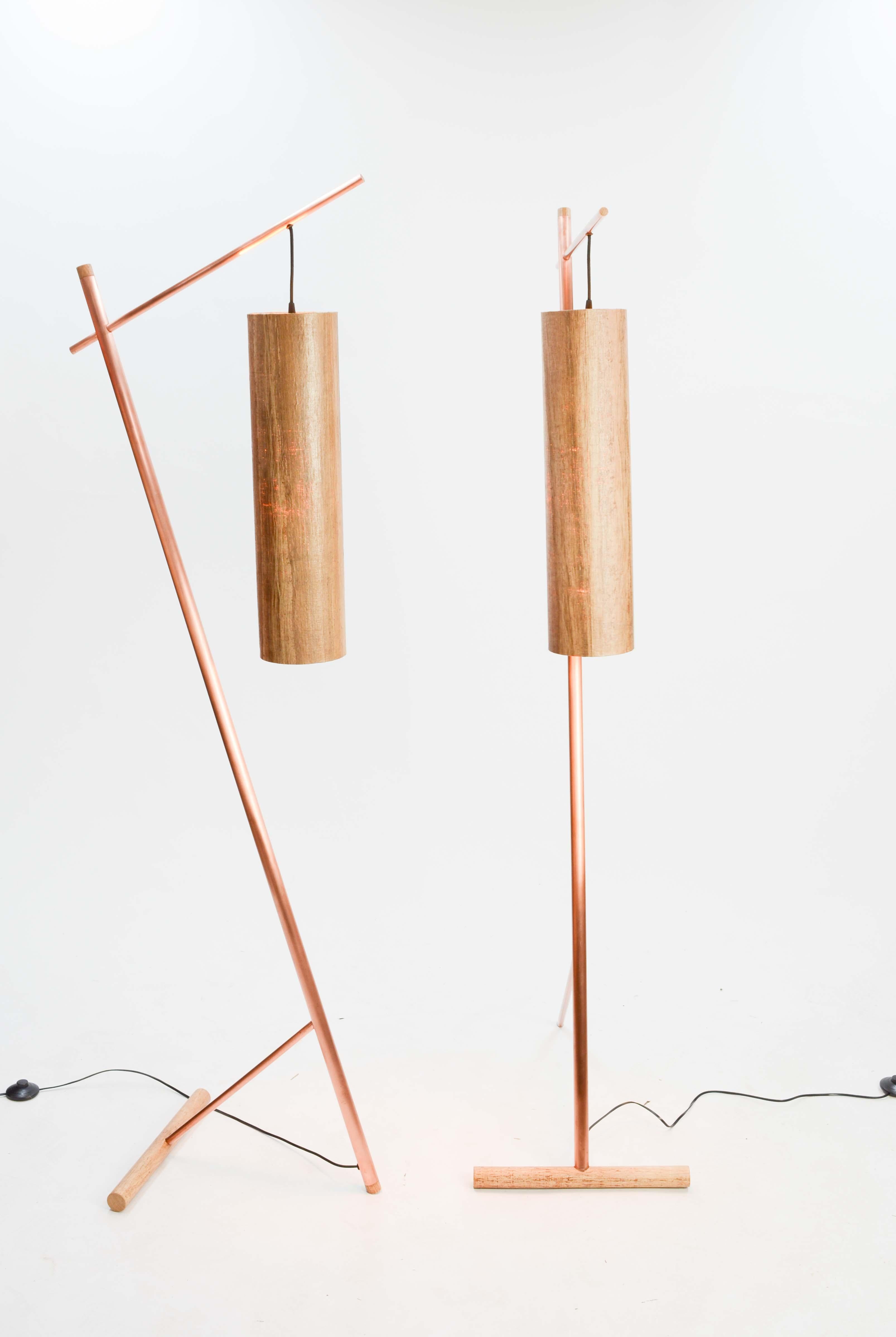 A pair of stylist and elegant floors lamps by seasoned art James Violette. The pair have a uniformed blended Aesthetic of old world craftmanship and new world technology. The simplistic design gives clear nods to Japanese modernism and Italian use