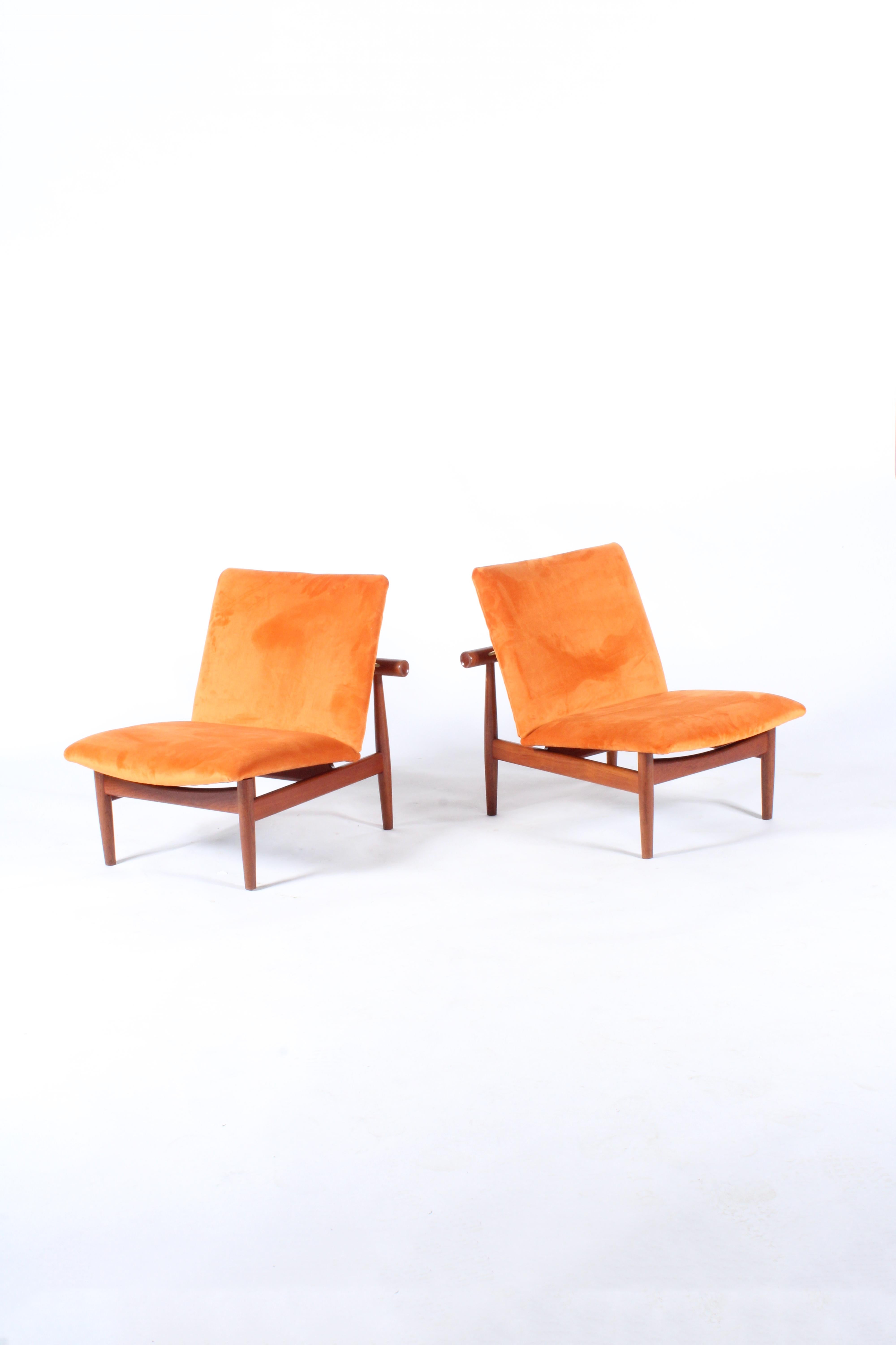 A rare opportunity to purchase a pair of original early edition Japan chairs by legendary Danish designer Finn Juhl. Sourced from a private collection in Paris we have had this beautiful pair professionally restored and refinished in a vibrant