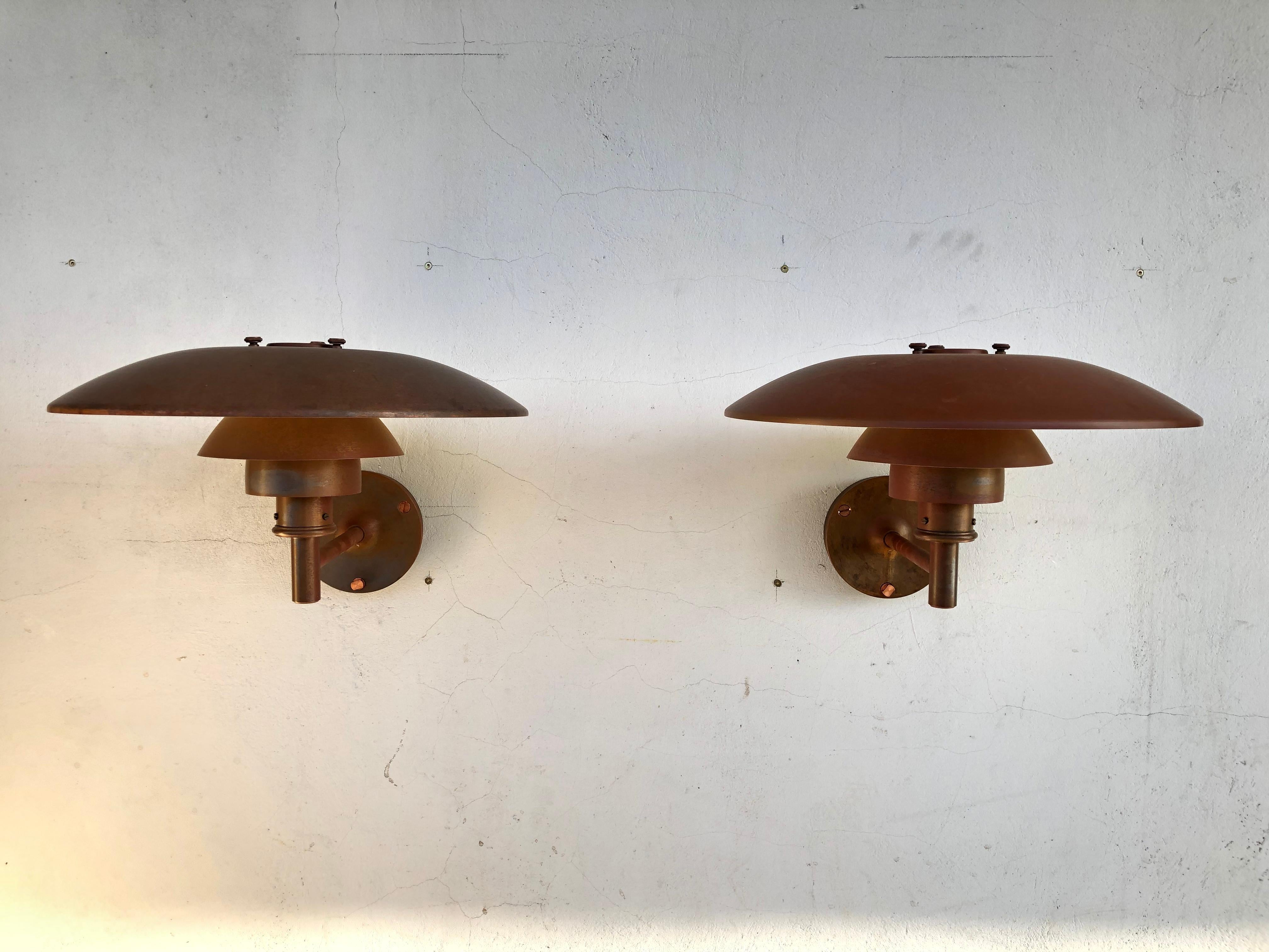 A pair of iconic Poul Henningsen copper wall lamps PH 4.5 made in Denmark by Louis Poulsen from the 2000s
This iconic lamp was first designed in 1966 and has been a Classic ever since
This pair of lamps are in original condition with lovely patina