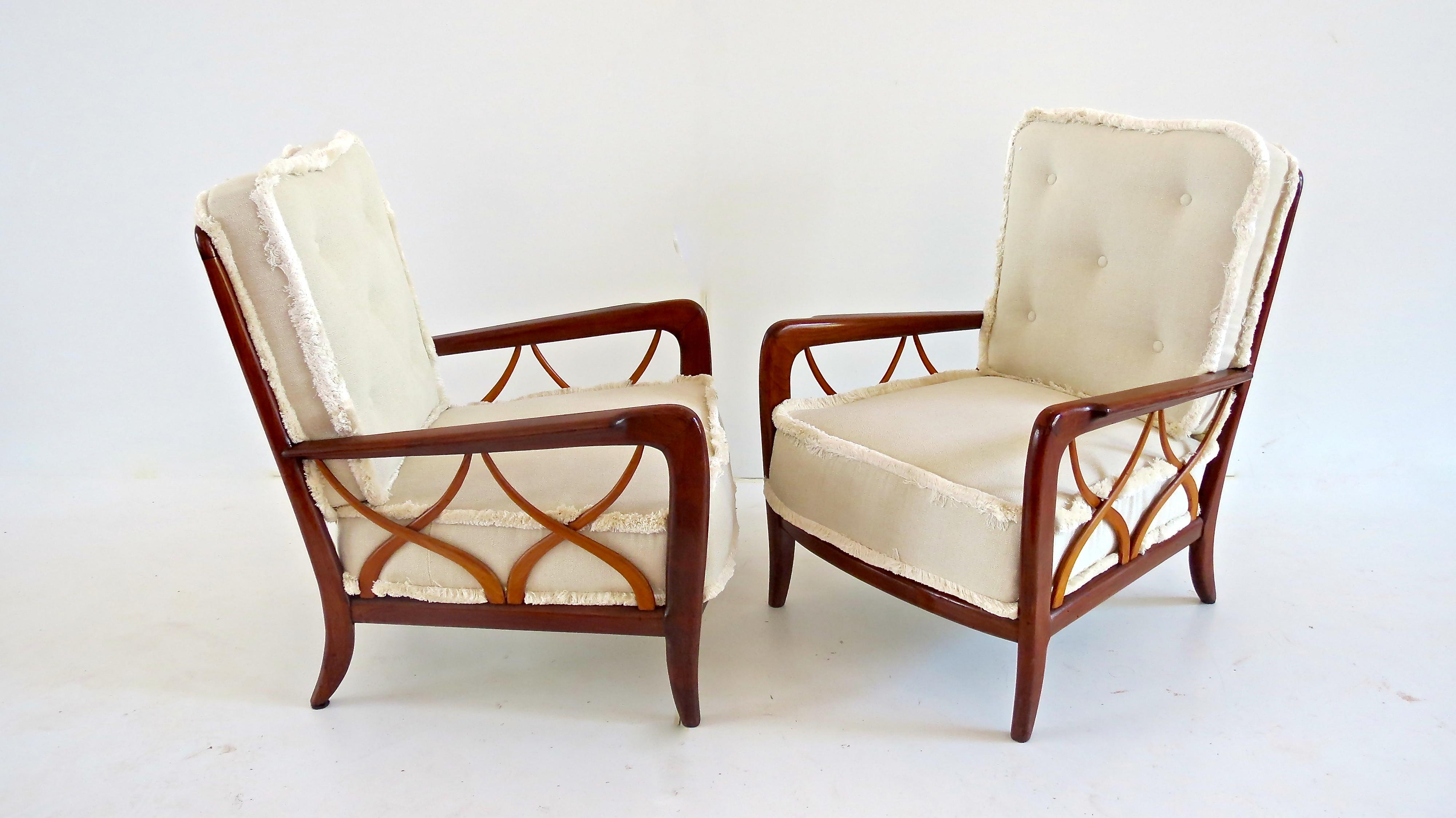 Important elegant pairs of armchairs, attributed by Arch. Paolo Buffa in 1940
Each chair with incurved, rectangular, vertically slatted backrest above moulded, fluted waterfall arms; centring a rhomboid, loosed back cushion above a conforming seat