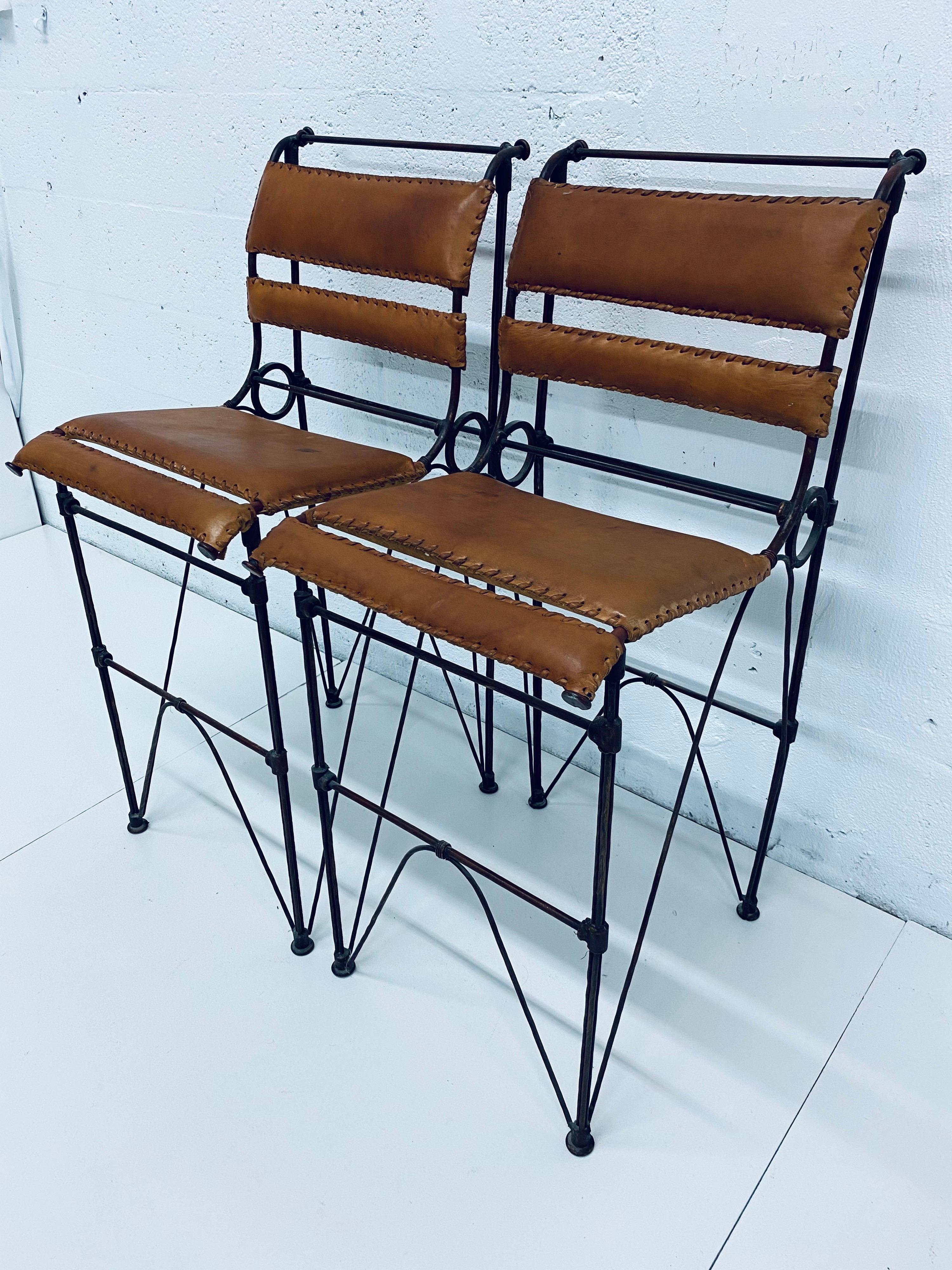 Pair of Ilana Goor attributed brown leather and iron rebar barstools or bar chairs, circa 1970s.