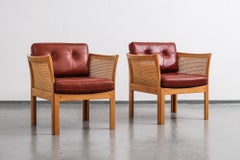 Pair of Illum Wikkelsø 'Plexus' Easy Chairs in Oak and Coqnac Leather, 1960s