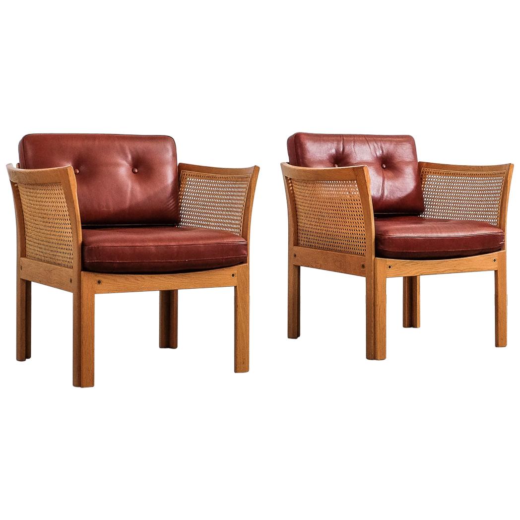 Pair of Illum Wikkelsø 'Plexus' Easy Chairs in Oak and Coqnac Leather, 1960s