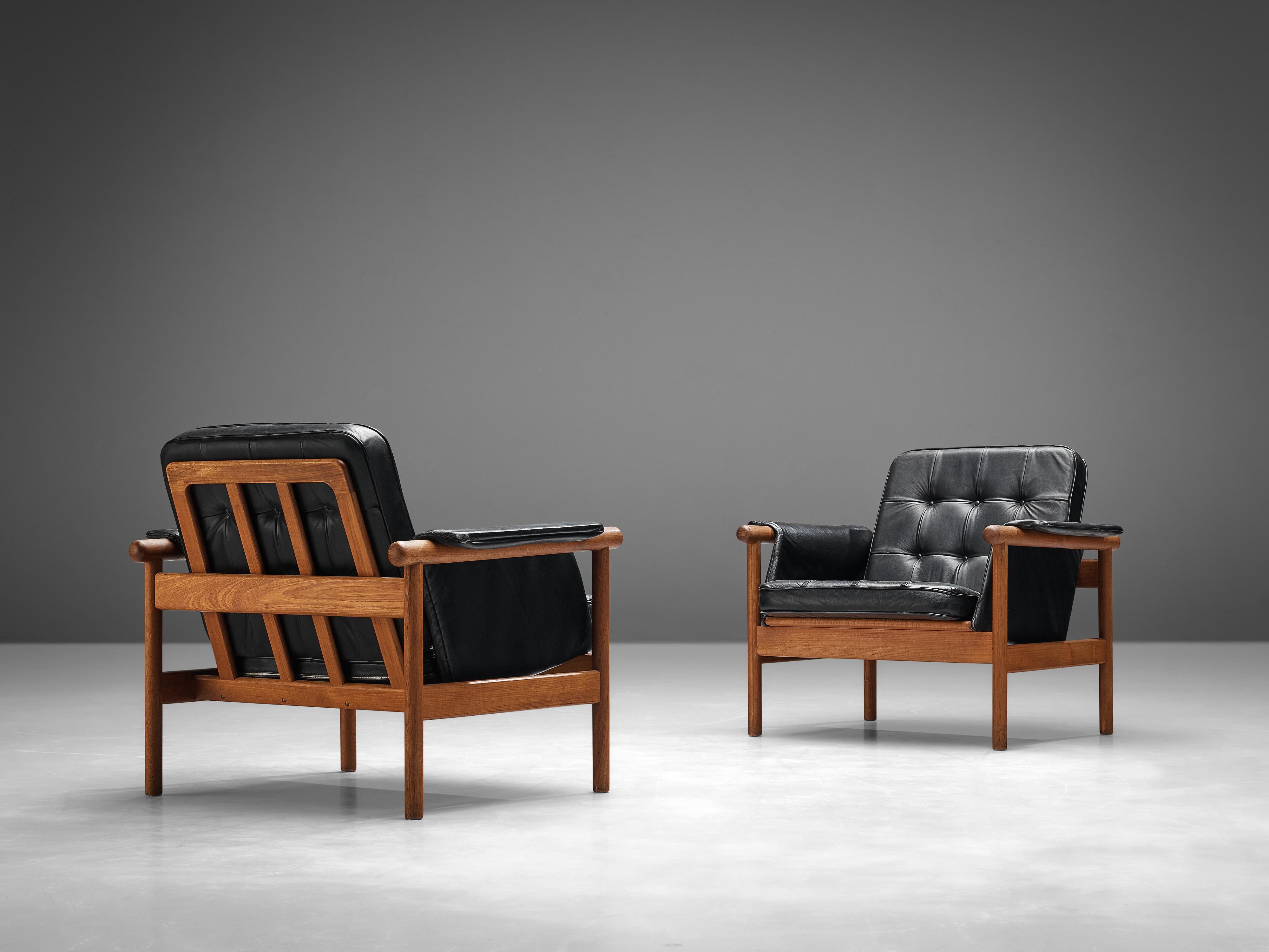 Illum Wikkelsø, easy chairs model 'Wiki', black leather, teak, Denmark,1960s

This set of easy chairs feature a teak frame with a slatted back and an angular, geometric frame. The chairs are named 'Wiki' and feature a tufted seat and back cushion to