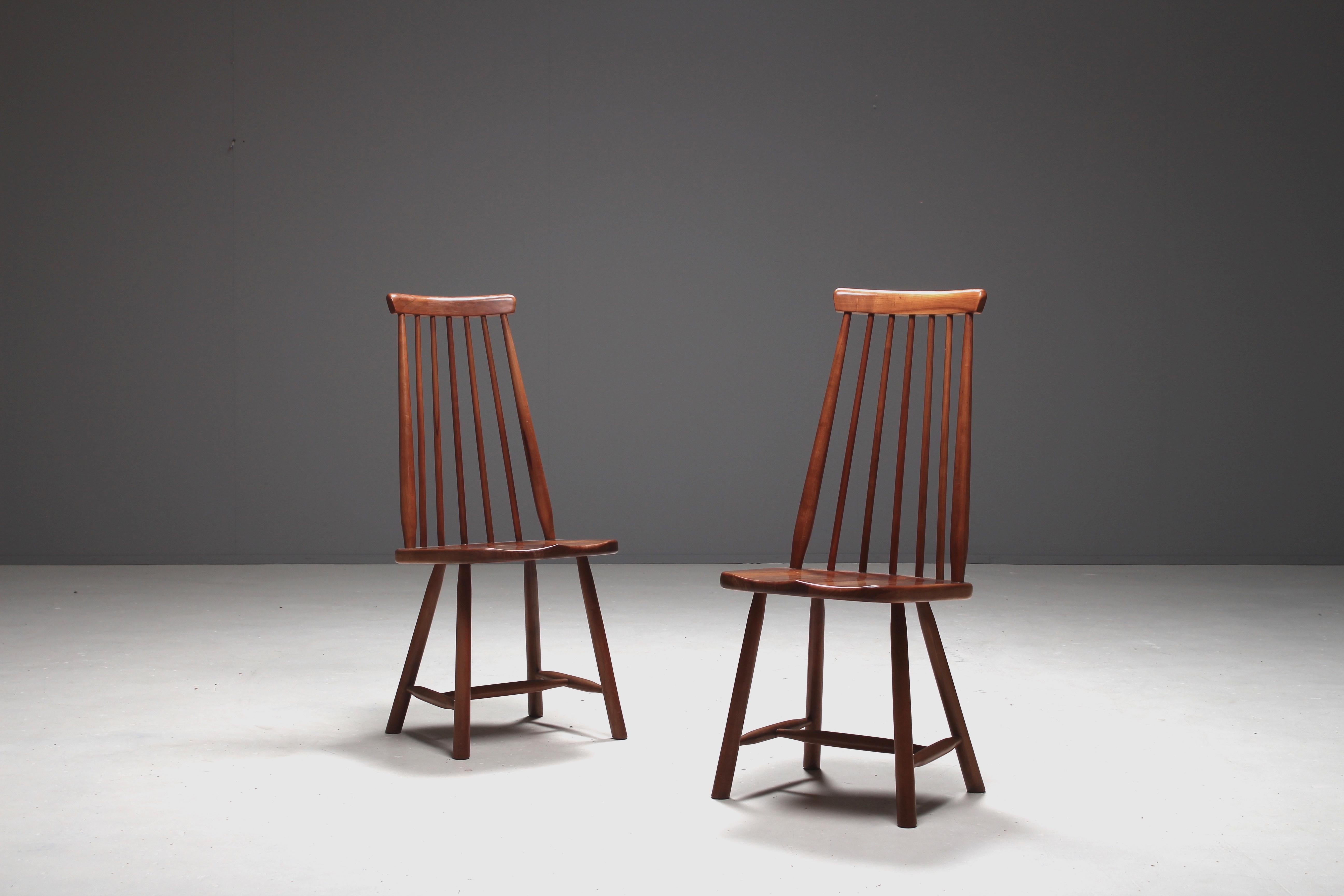 A wonderful pair of walnut chairs which we attribute to the famous Finnish furniture designer Ilmari Tapiovaara. Produced in the 1960s.
The chairs strongly refer to the well known 'Mademoiselle' chair by Tapiovaara.
The seats of these chairs are