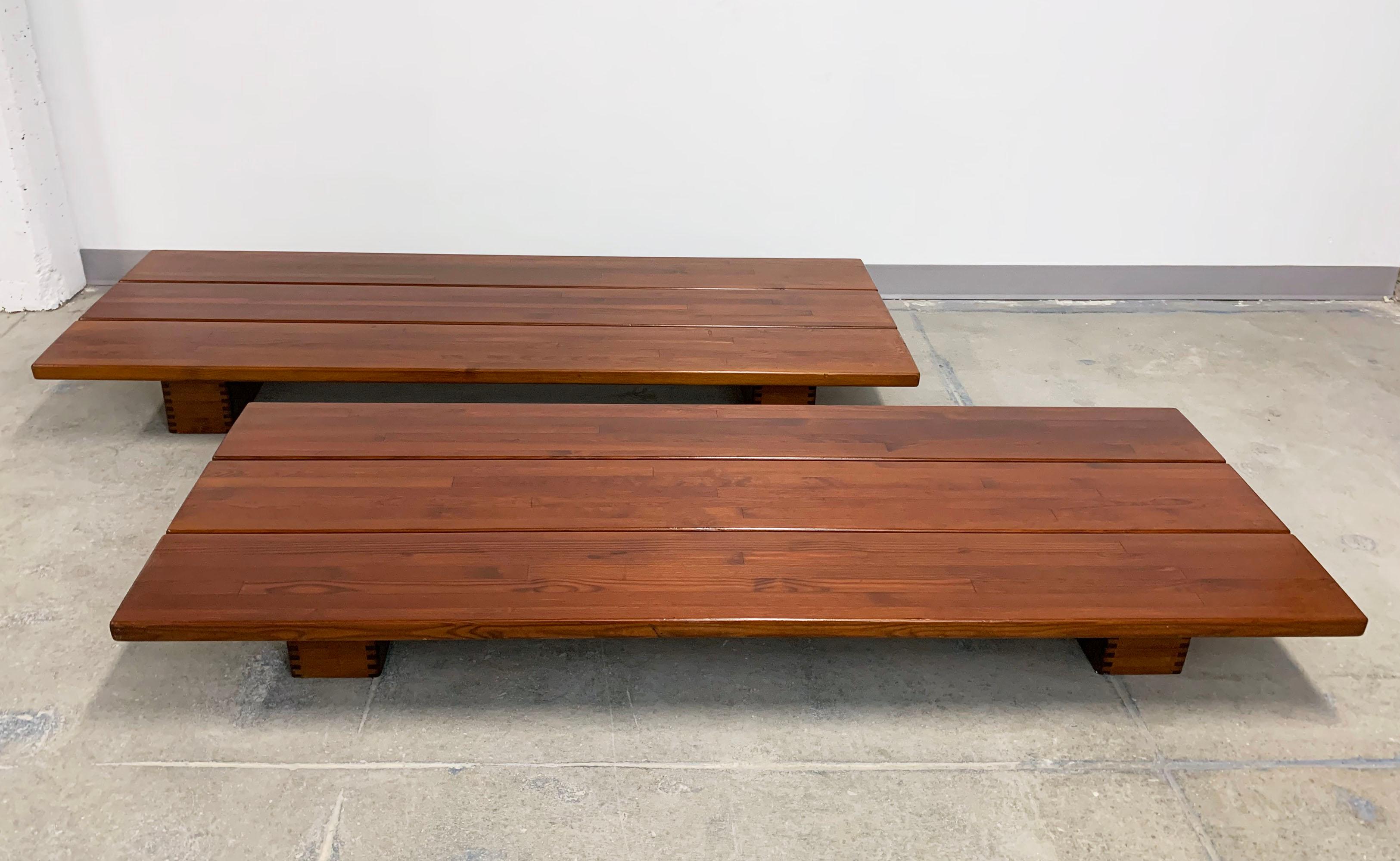 A pair of daybed benches by Ilmari Tapiovaara for Laukaan Puu of Finland, circa 1950s in staved pine. Sturdy platforms provide seating or may be used as coffee tables or cabinet stands.