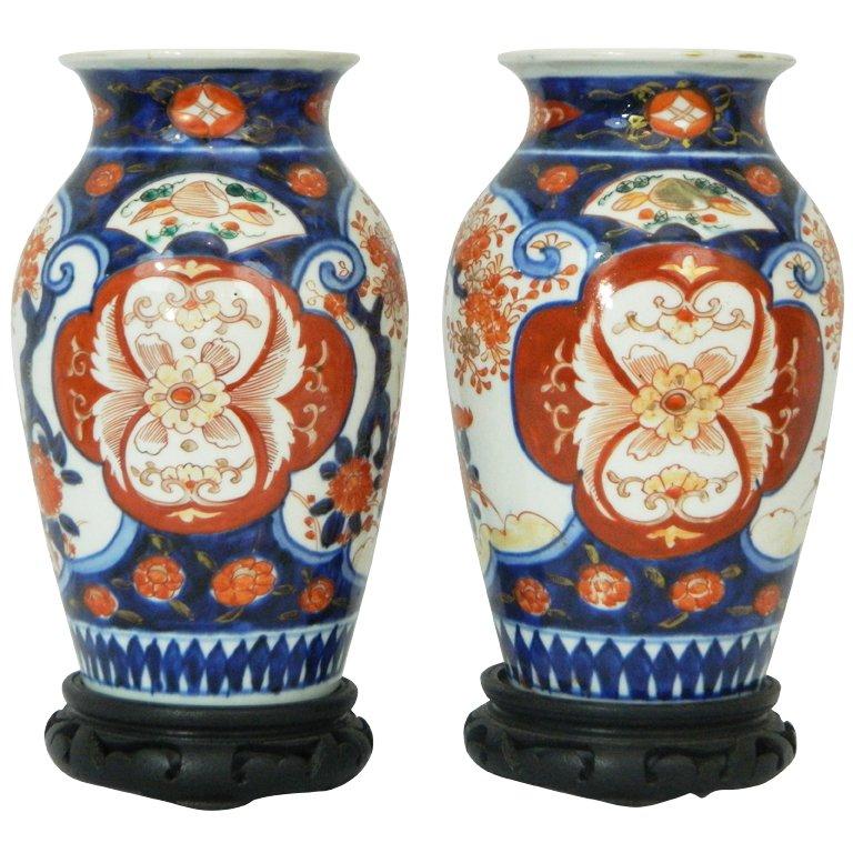Pair of Imari Vases Depicting Floral Decorations on Stands, Early 20th Century