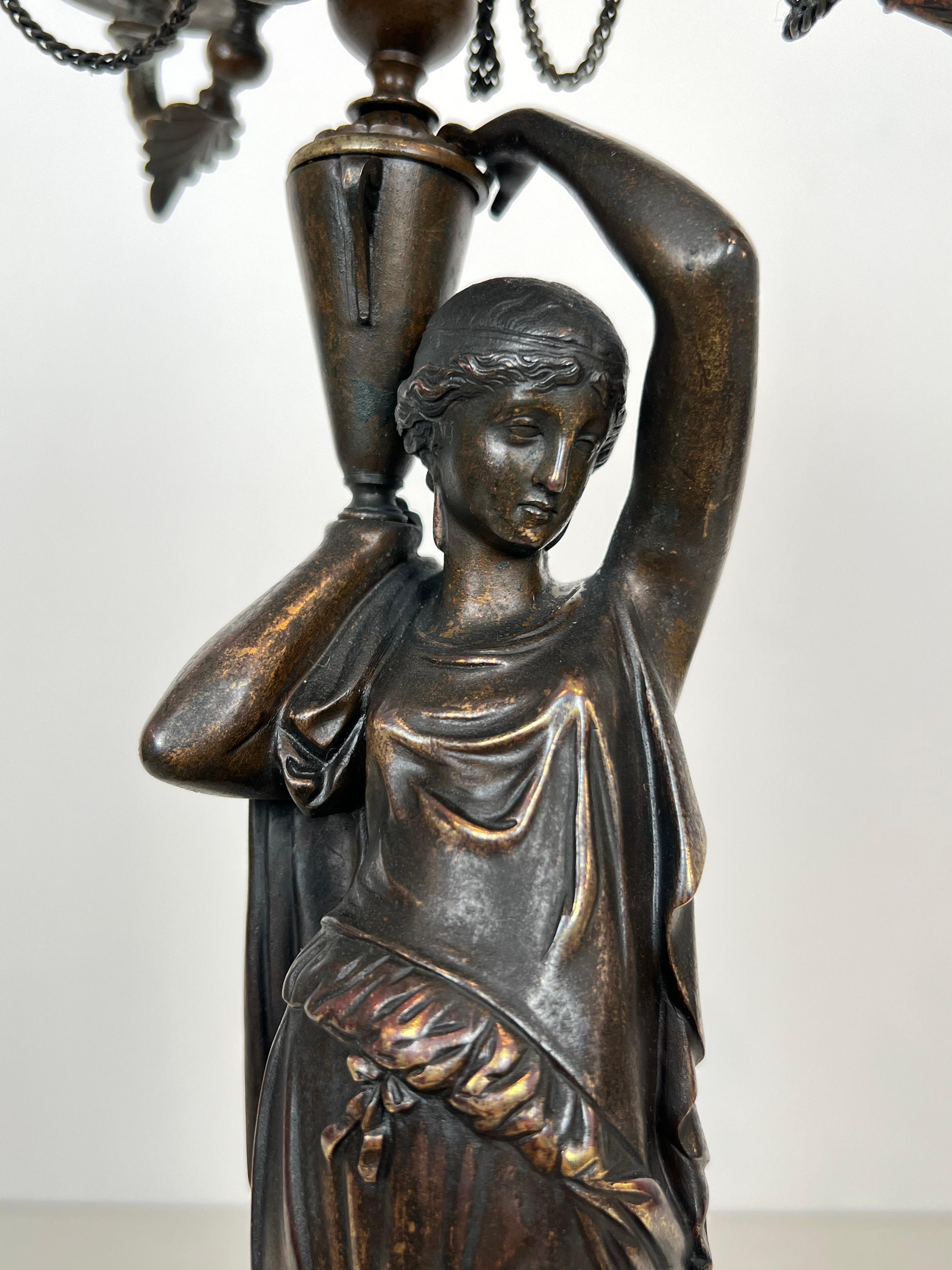 Pair of Important Candelabra in Patinated Bronze Presenting Caryatids Carrying For Sale 1