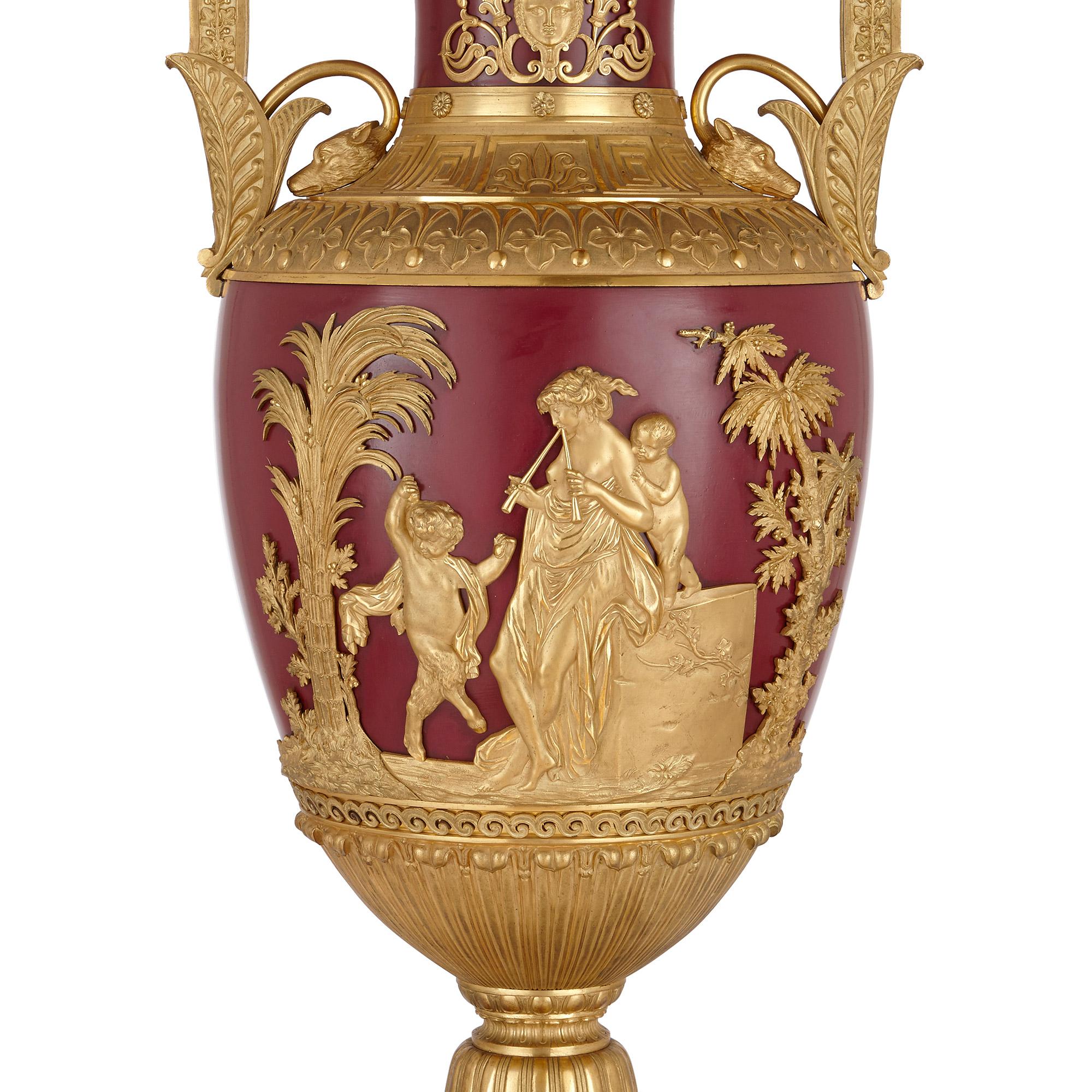 Pair of important Russian gilt bronze and metal vases
Russian, circa 1820
Dimensions: Height 98cm, width 43cm, depth 38cm

This monumental pair of vases are exquisitely crafted in gilt bronze and metal. They both feature twin scrolled handles,