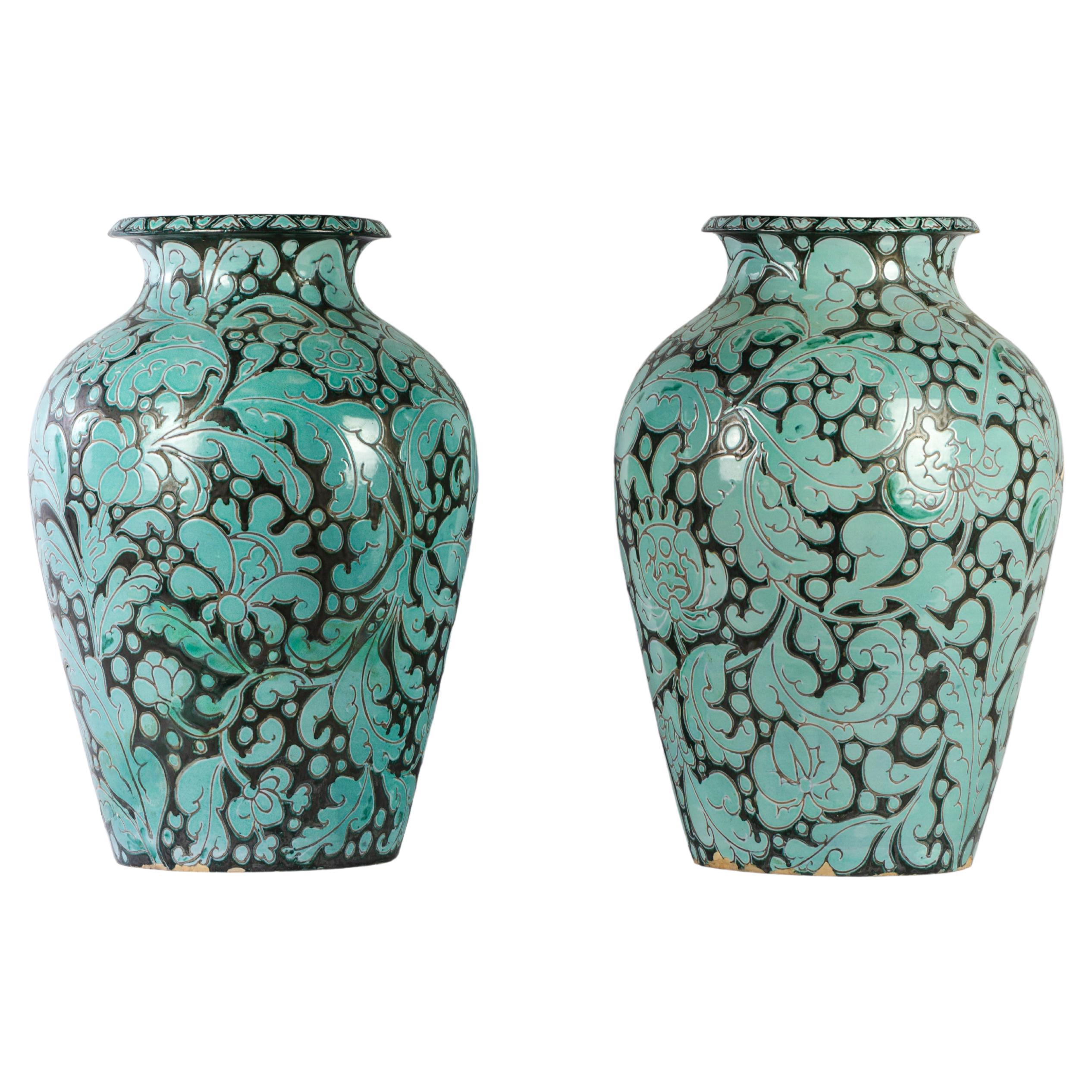 Pair of impressive blue and black vases with floral pattern For Sale