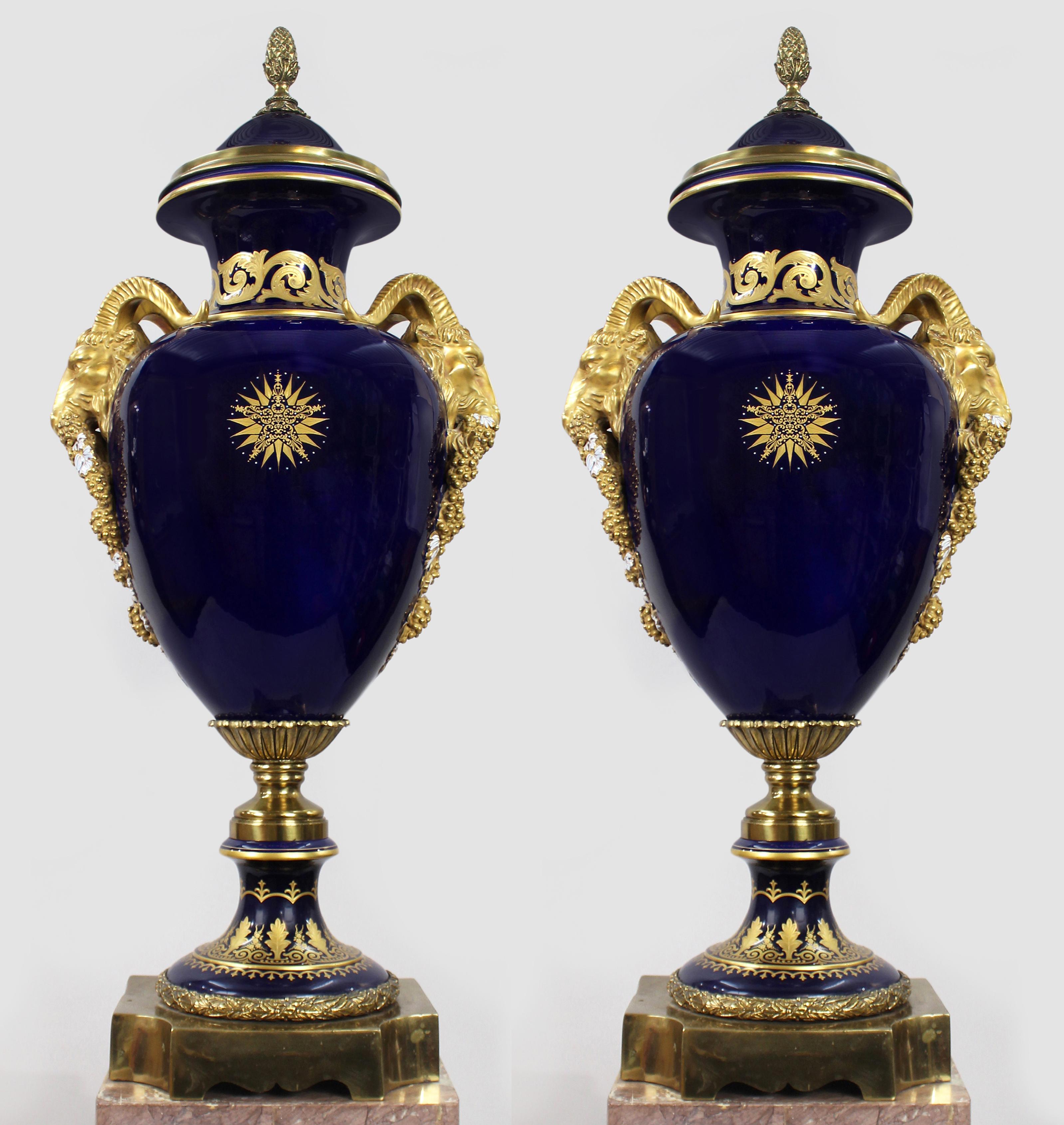 Pair of Fine Sevres Style Cobalt Blue Rams Head Lidded urns


We are pleased to offer a stunning matched pair of highly ornate late twentieth porcelain lidded urns.

Hand painted & gilded in a classical manner with a stunning cobalt blue