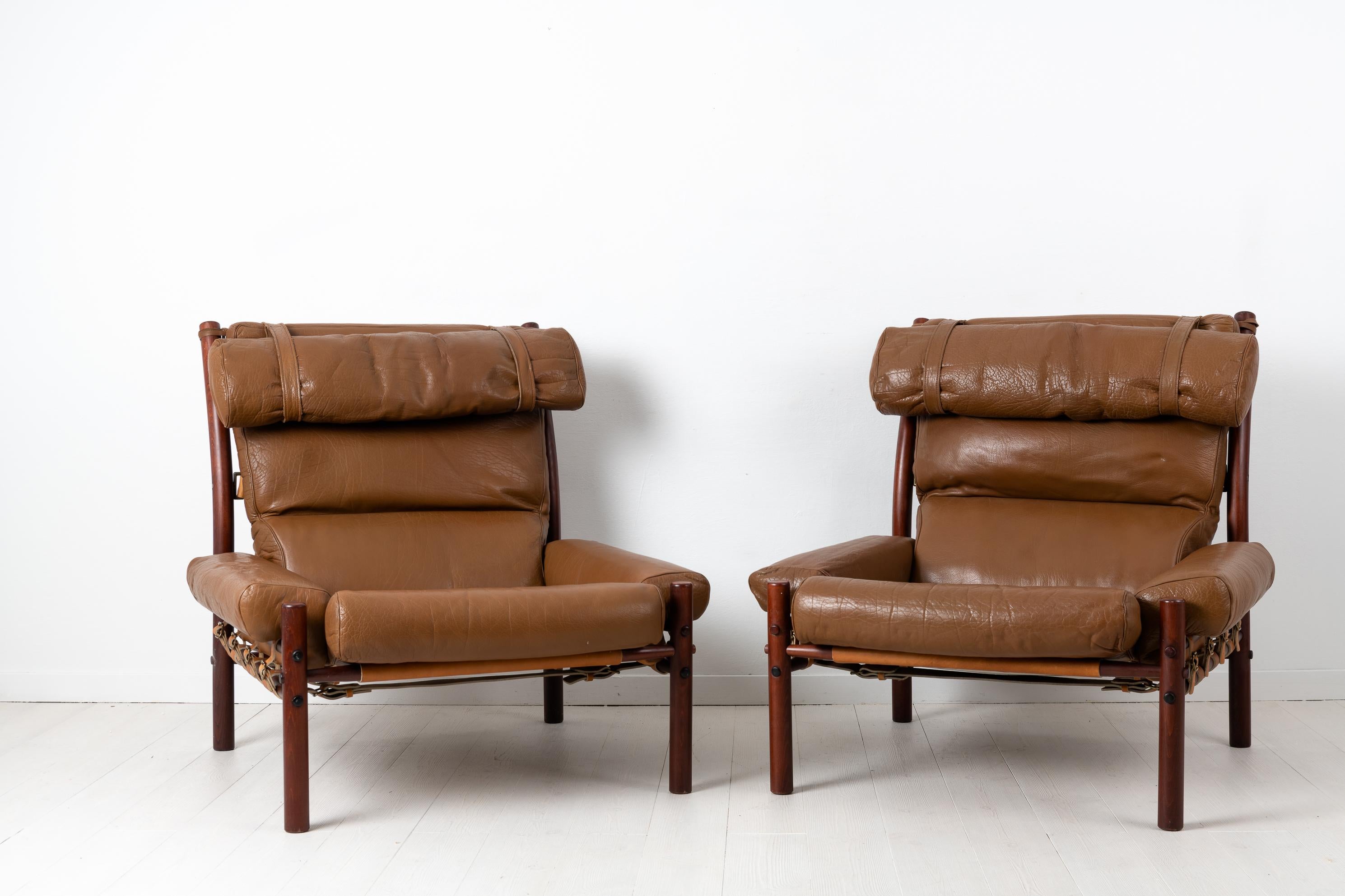 Pair of Inca armchairs by Arne Norell designed 1971. The pair of armchairs have upholstery in buffalo leather and frames made from birch. Manufactured by Norell Möbler during the 1970s. The frames are held together with only strong leather straps,