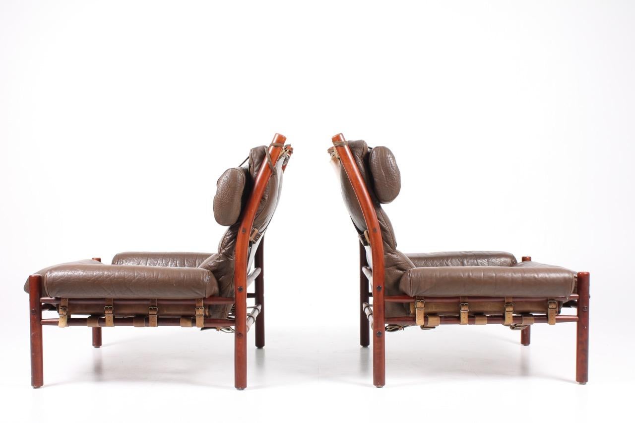 Pair of Inca series lounge chairs in patinated leather designed by Arne Norell in 1968. Made by Norell Möbel AB in Sweden. Great original condition.