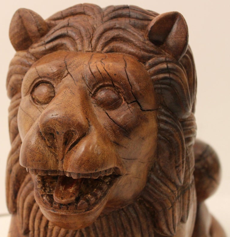 Pair of Indian Carved Teak Recumbent Lions Architectural Elements, circa 1900 For Sale at 1stdibs