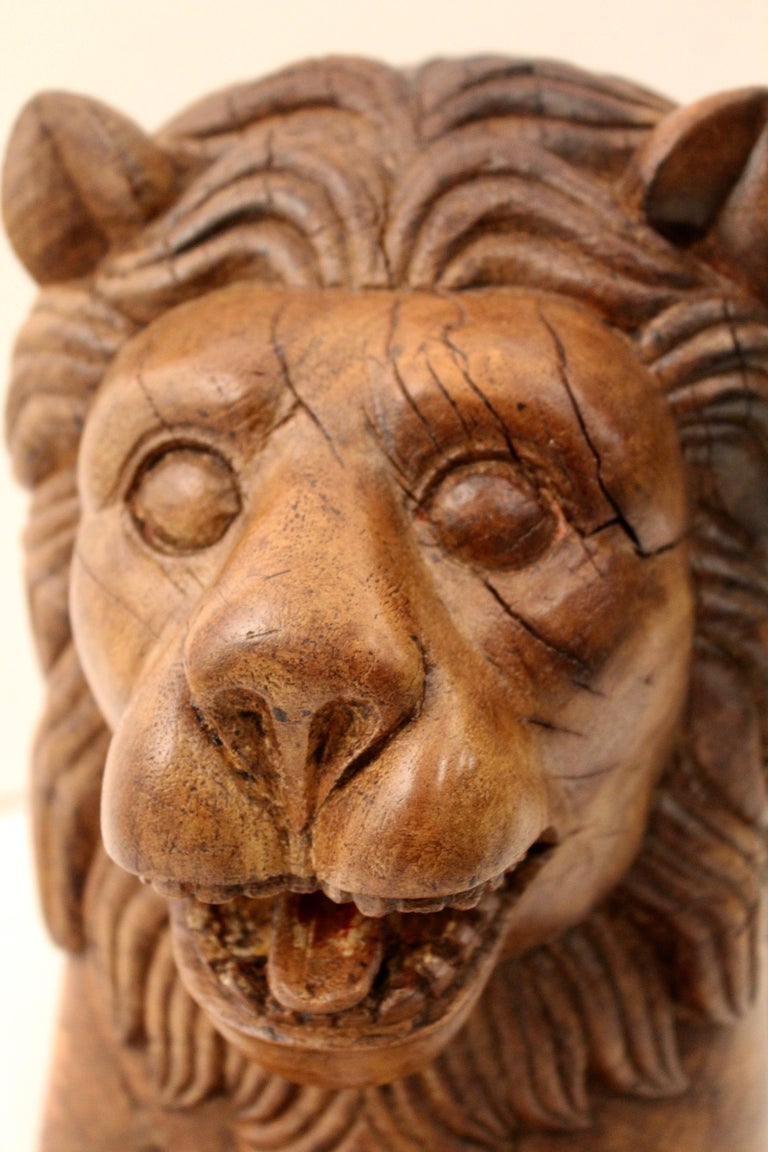 Pair of Indian Carved Teak Recumbent Lions Architectural Elements, circa 1900 For Sale at 1stdibs