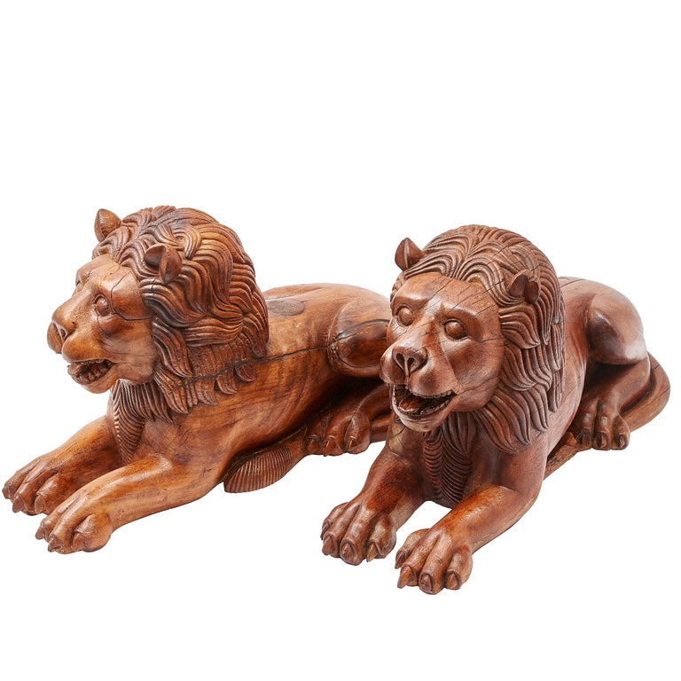 Pair of Indian Carved Teak Recumbent Lions Architectural Elements, circa 1900 For Sale at 1stdibs