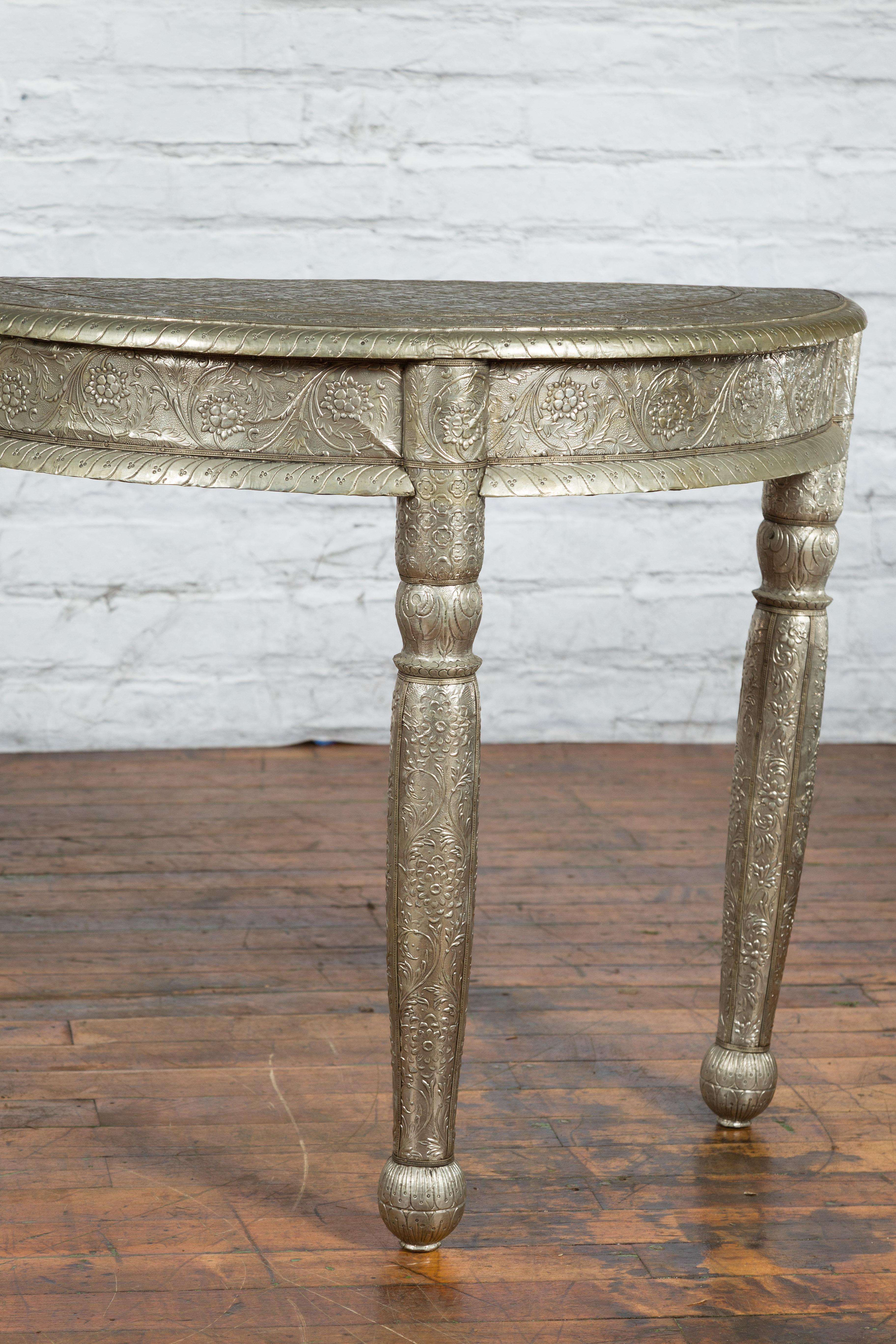 Sheet Metal Pair of Indian Metal Sheathing Repoussé Demilune Tables with Floral Arabesques For Sale