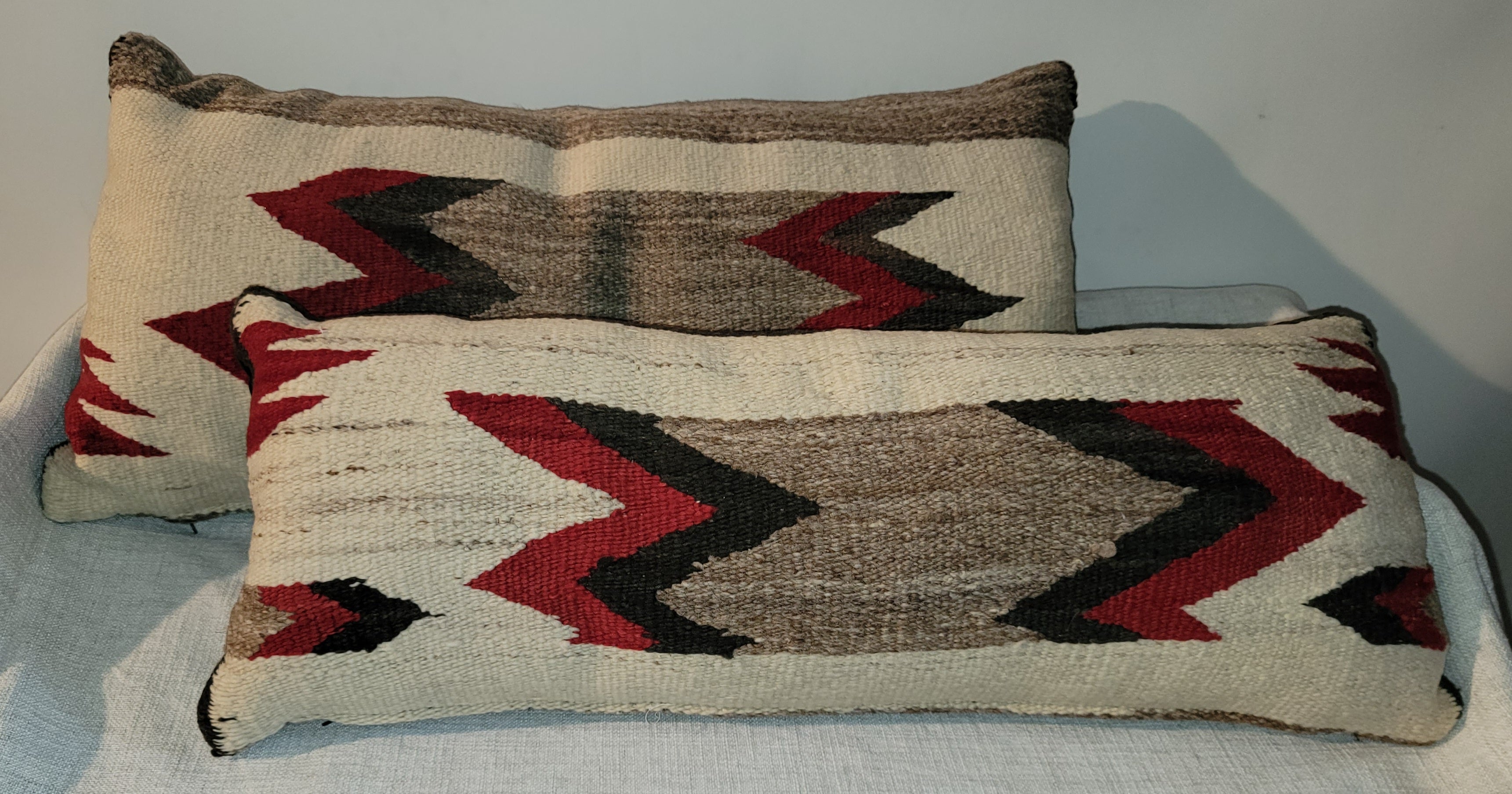 Pair of Indian Weaving Bolster pillows 

pillow 28 x 13
smaller pillow 11 x 28.