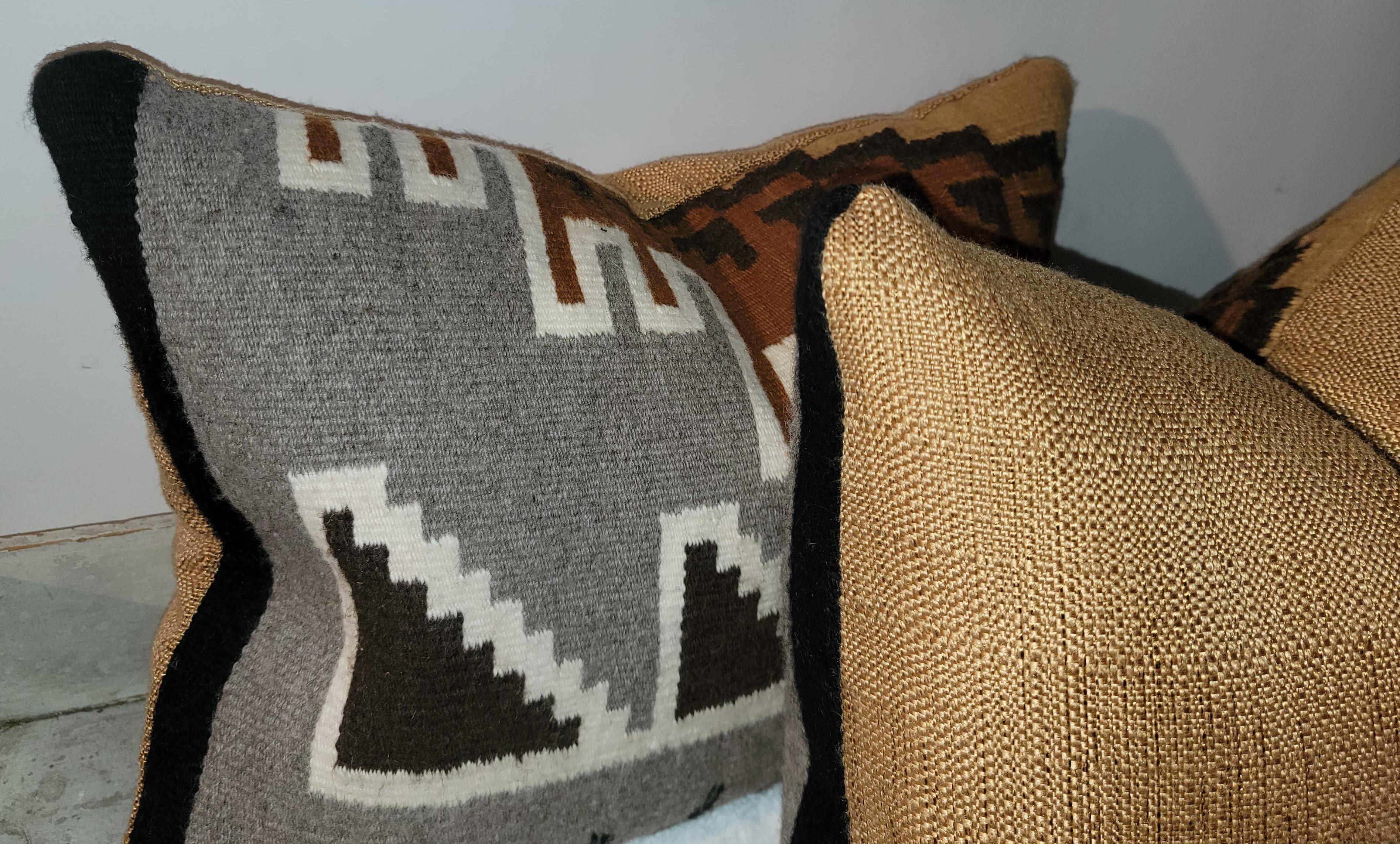 Pair of Navajo Indian weaving pillows. Feather and down inserts and zipped casing.