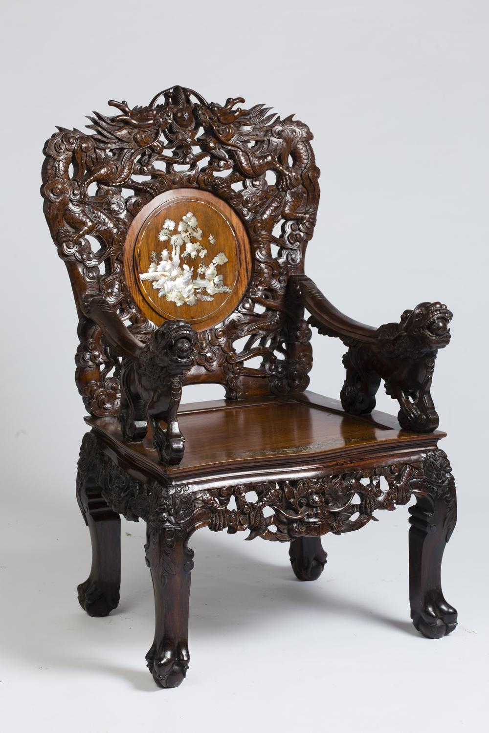 Pair of Indochinese armchairs, circa 1880-1900, in finely carved and openwork ironwood, inlaid with a rich decoration of mother of pearl Marquetry.
The two armchairs are identical but each mother of pearl medallion has a different decor.