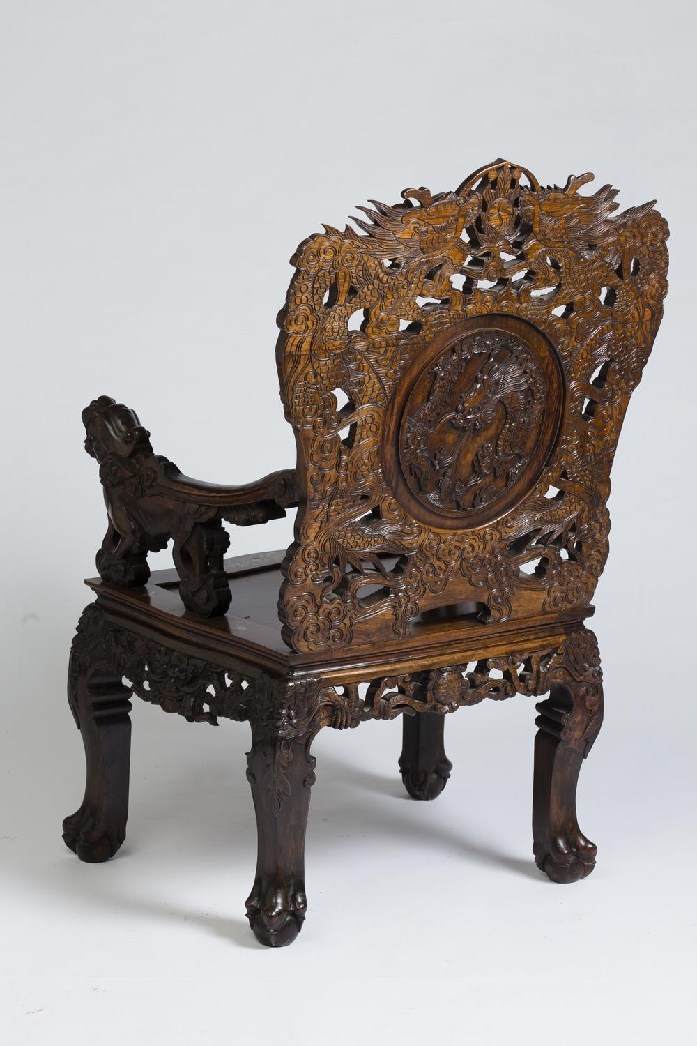 Pair of Indochinese armchairs, circa 1880-1900, in finely carved and openwork ironwood, inlaid with a rich decoration of mother-of-pearl marquetry.
The two armchairs are identical but each mother of pearl medallion has a different decor.