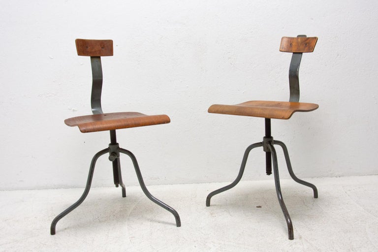 A pair of Industrial adjustable desk chairs with swivel function, Mid Century, Czechoslovakia.
Wood and metal construction, very comfortable. In very good condition. Price is for the pair.

Measures: Height: 82 cm

width: 38 cm

depth: 46